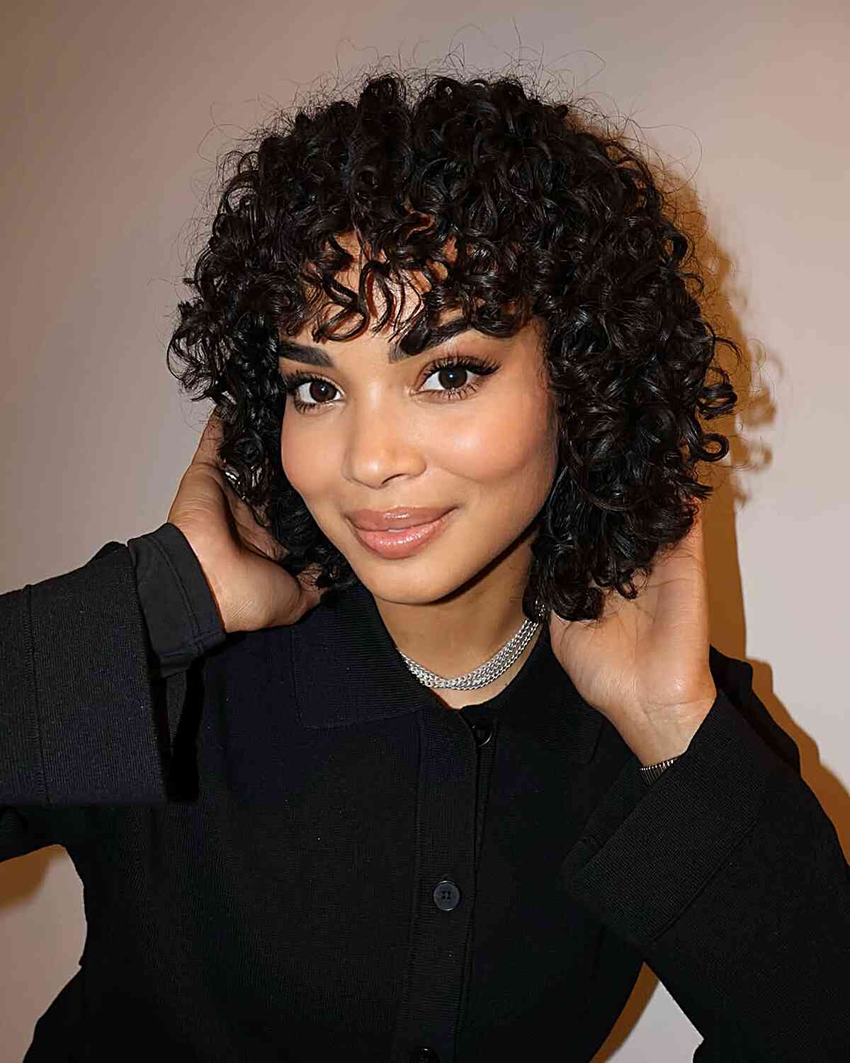 Playful Short Curly Bob with Soft Fringe