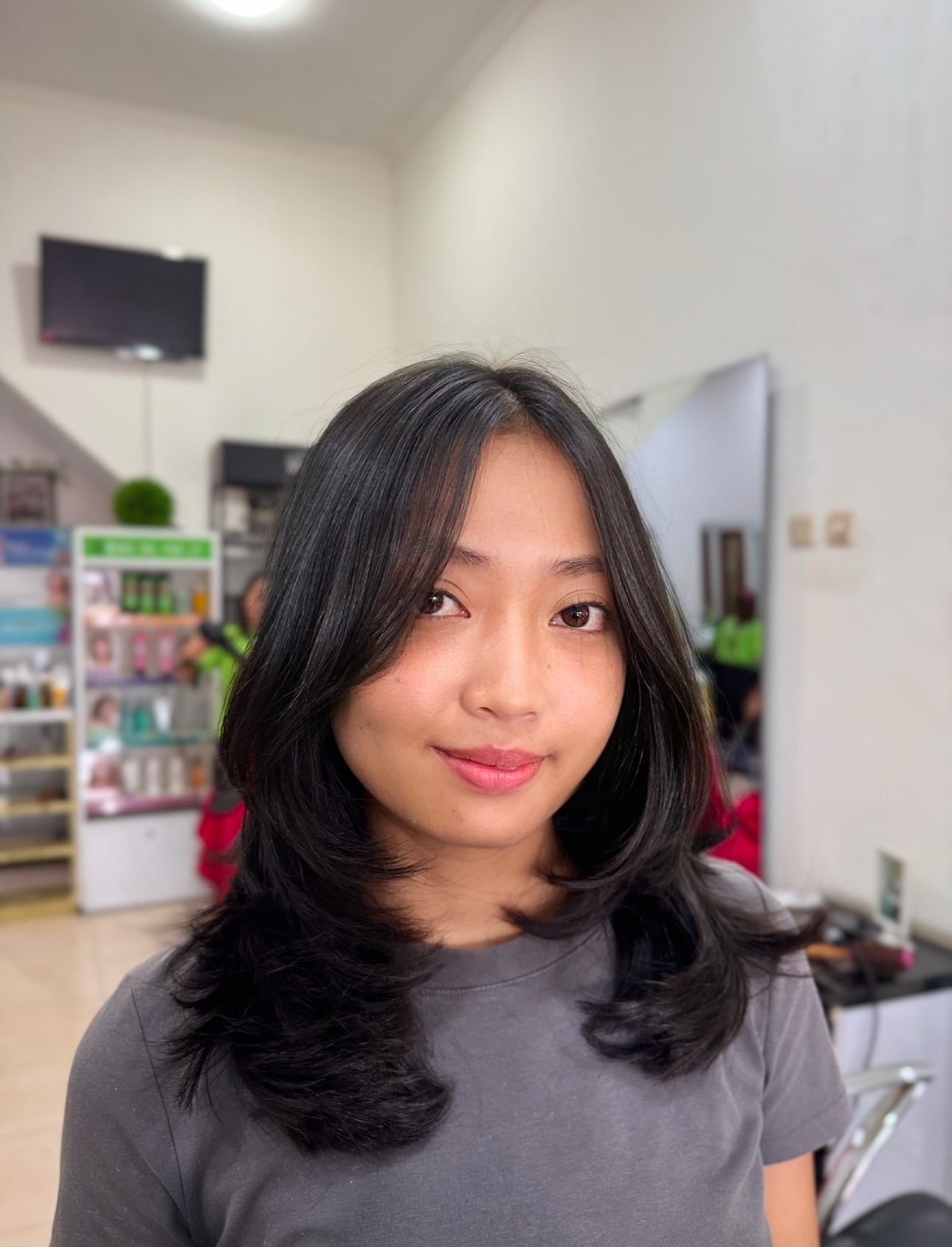 Rounded Shoulder-Length Cut with Breezy Center-Part Curtain Fringe