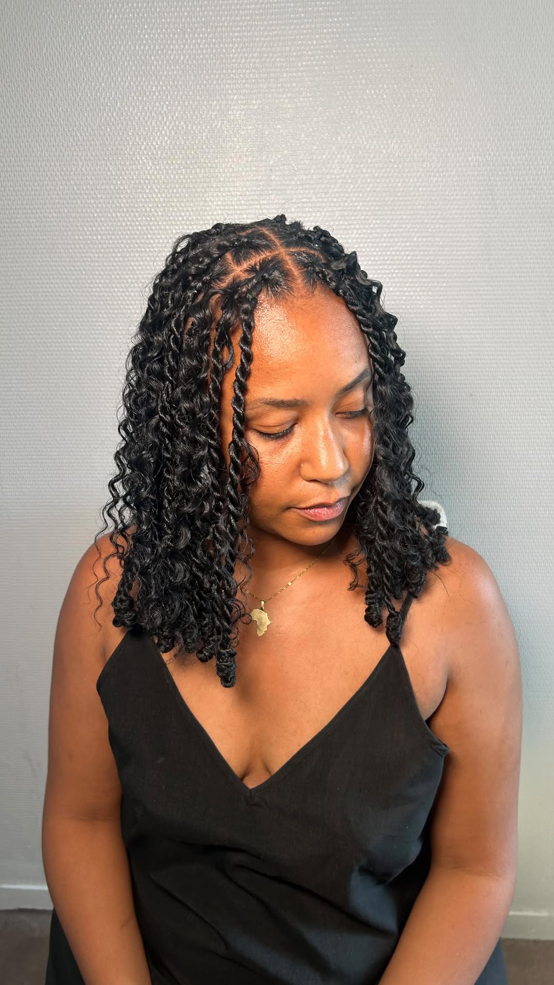 Shoulder-Length Twisted Bob with Defined Spiral Ends