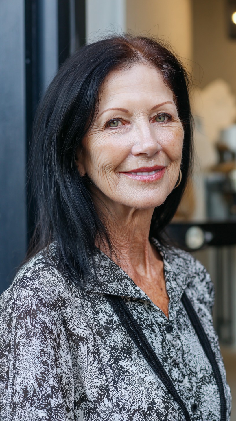 Sleek Shoulder-Grazing Black Lob with Warm Root Dimension