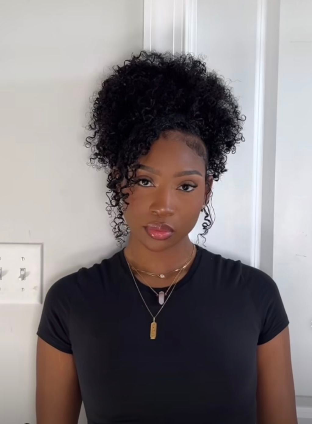 Voluminous High Curly Puff with Face-Framing Spiral Tendril