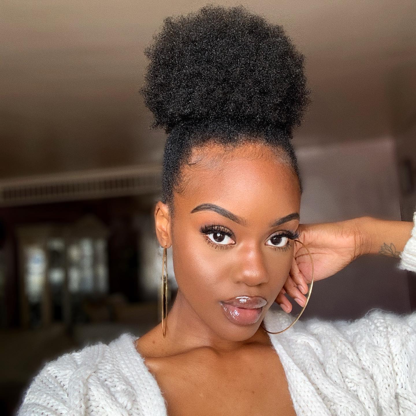 Elevated High Puff with Sleek Laid Edges