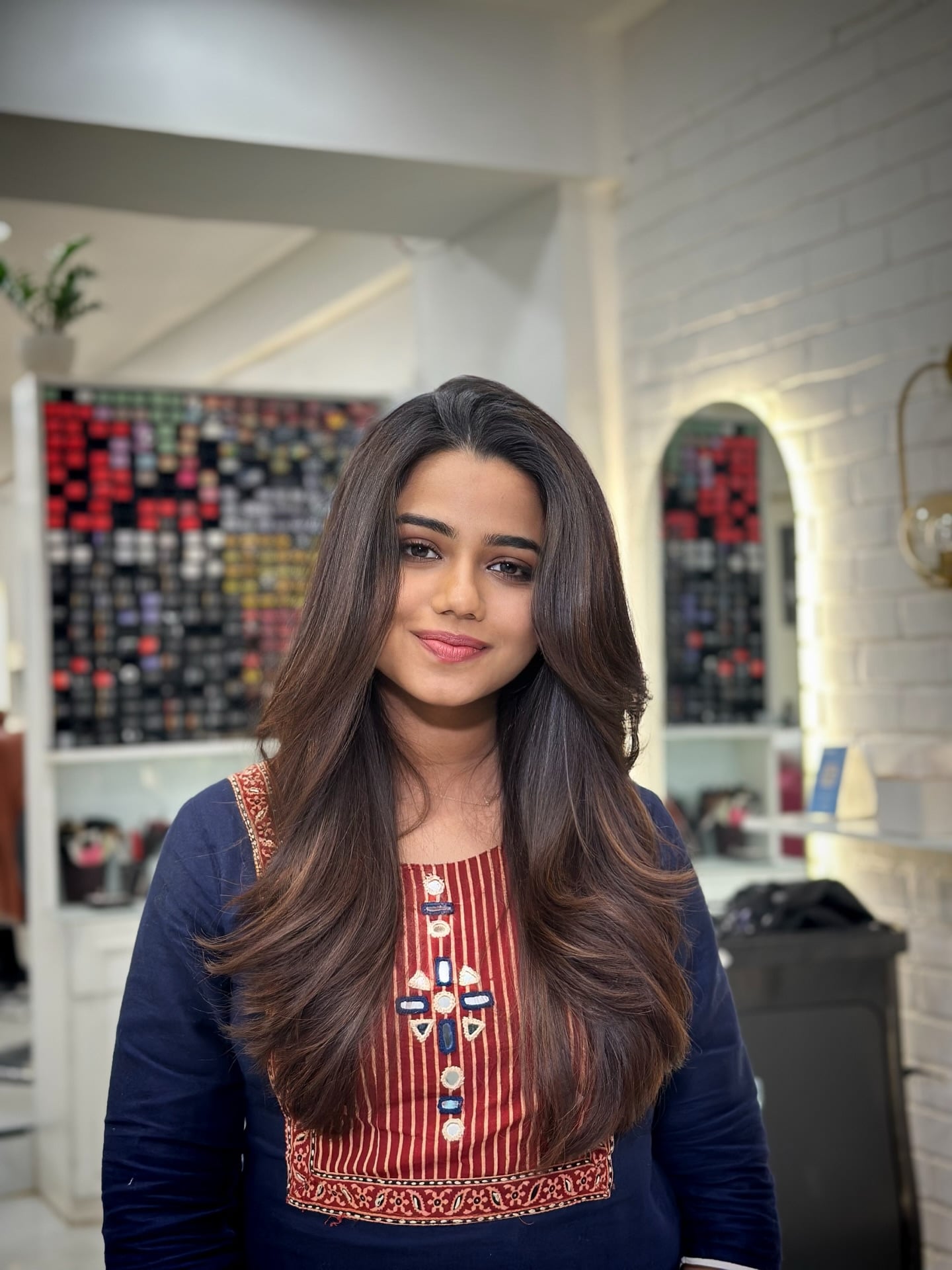 Lustrous Brunette Butterfly Layers with Soft Crescent Face Frame