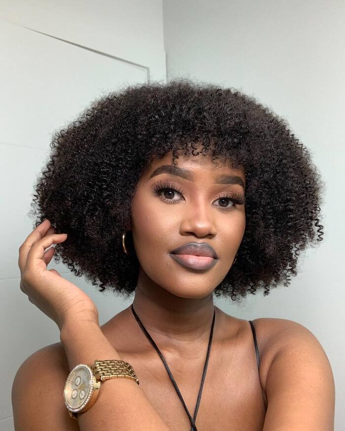Rounded Chin-Length Natural Curls with Soft Fringe
