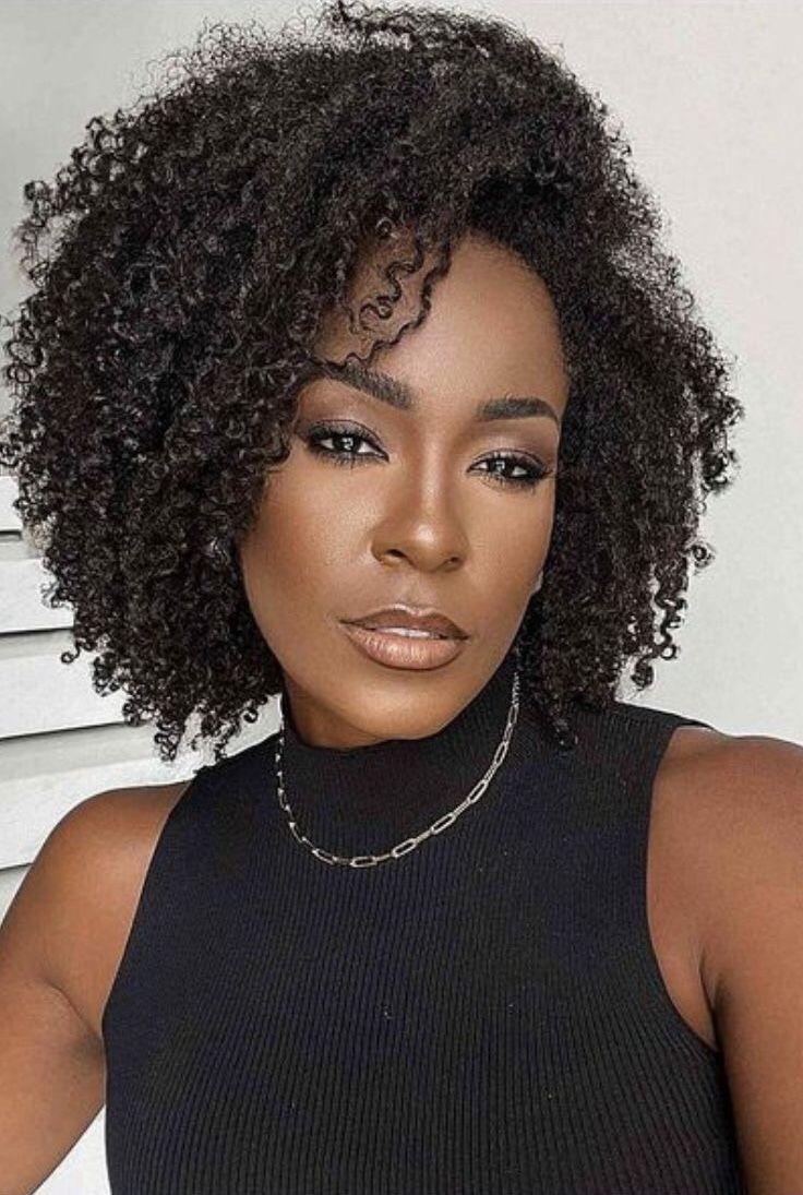 Rounded Layered Afro with Face-Framing Spiral