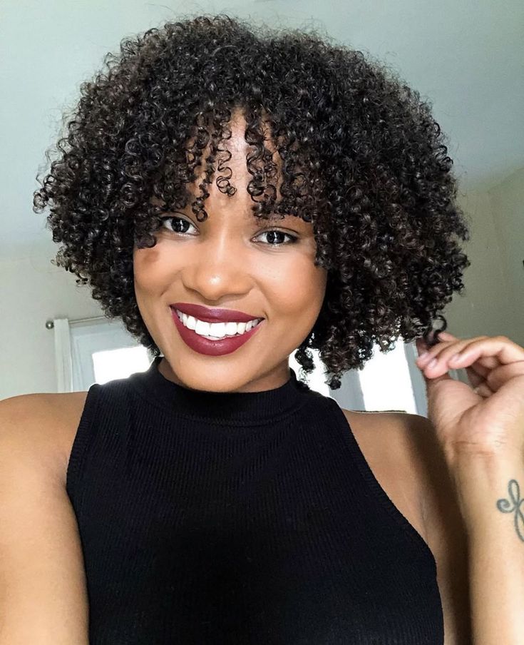 Rounded Layered Chin-Length Curly Bob with Curtain Ringlet Bangs