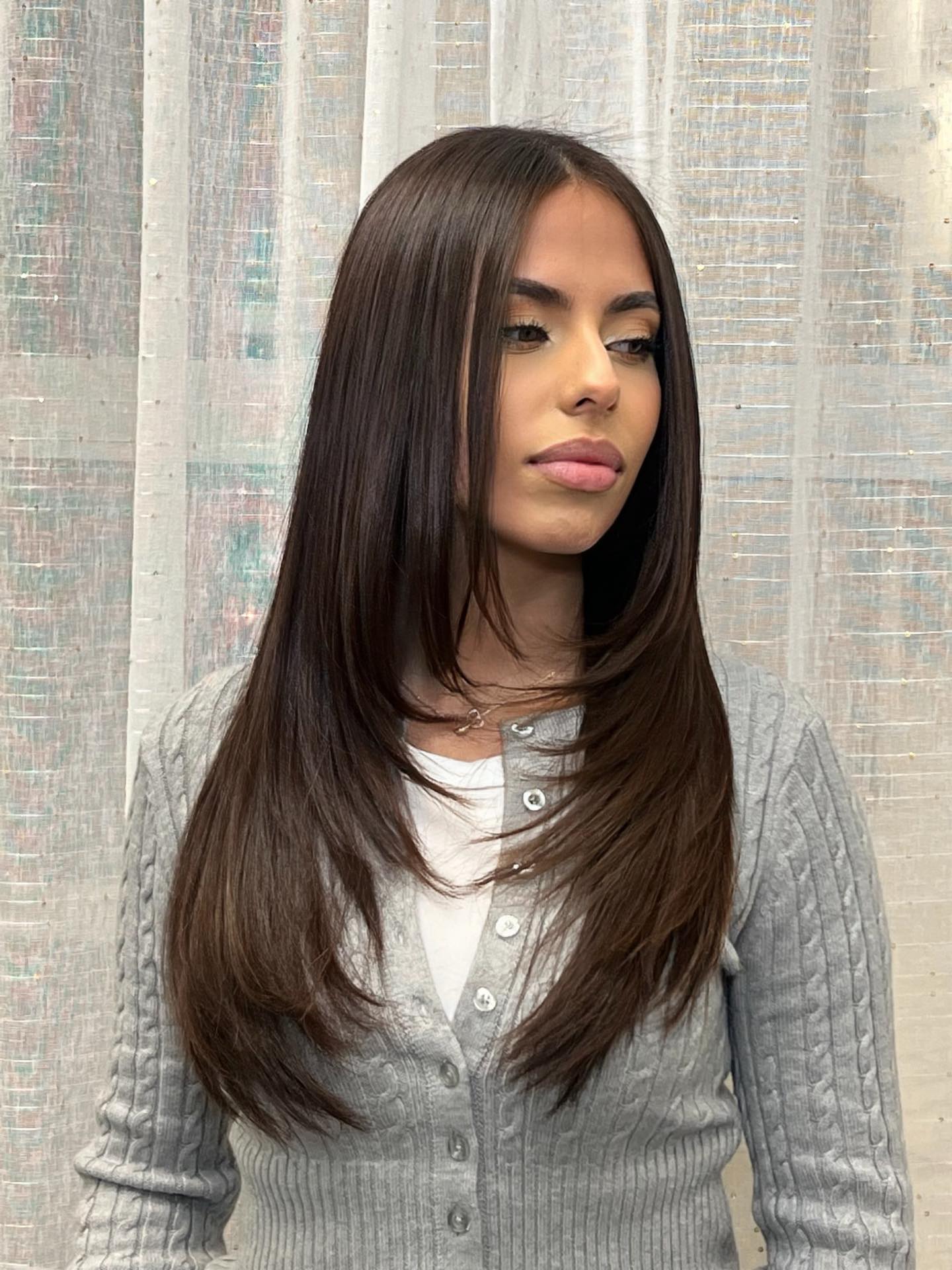 Sleek Long Face-Framing Layers with Polished Curtain Part