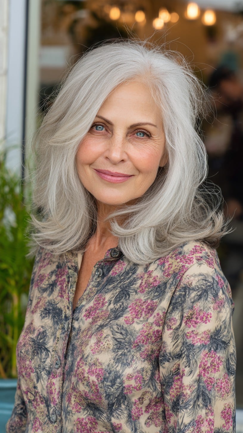 Soft Silver Mid-Length Layers with Face-Framing Flip