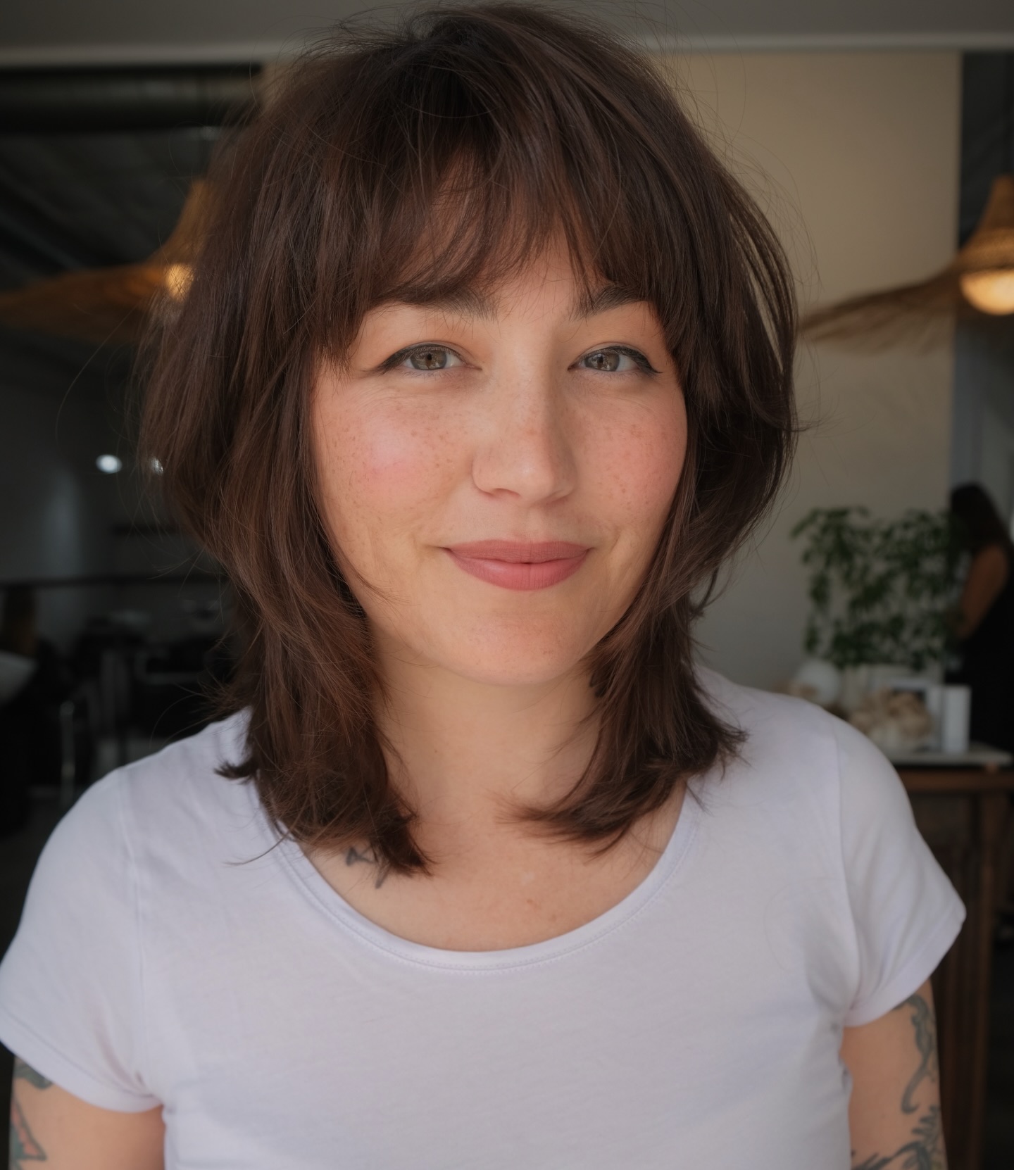 Chestnut Collarbone Shag with Feathered Face-Framing and Short Fringe