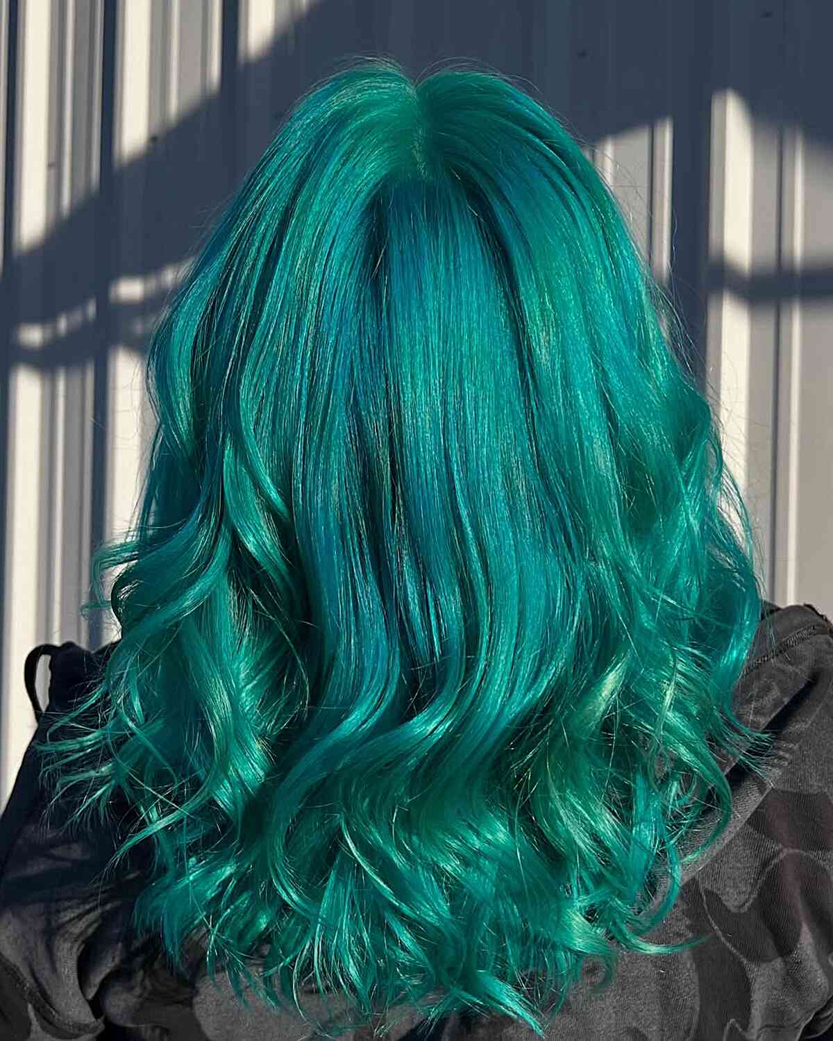 Vibrant Teal Long Layered Waves