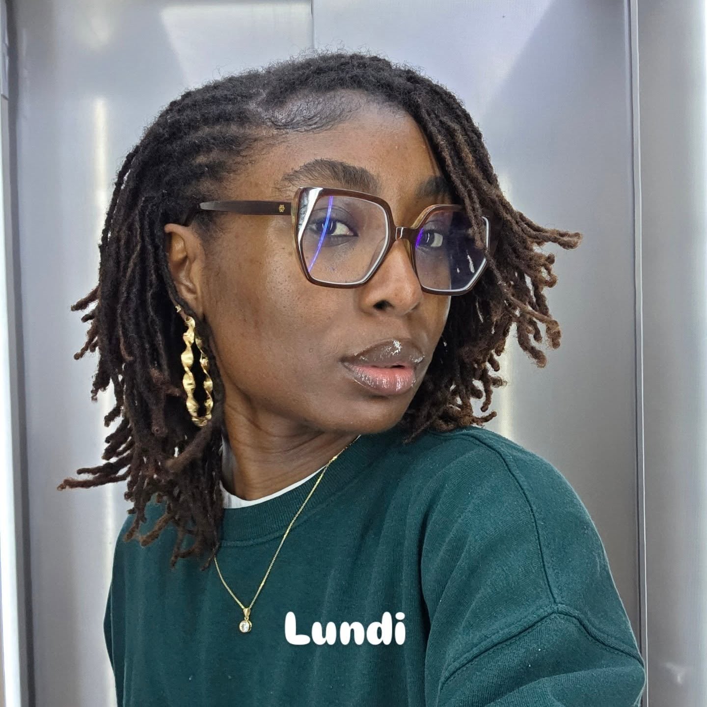Asymmetrical Side-Swept Shoulder-Length Locs with Cornrowed Parting