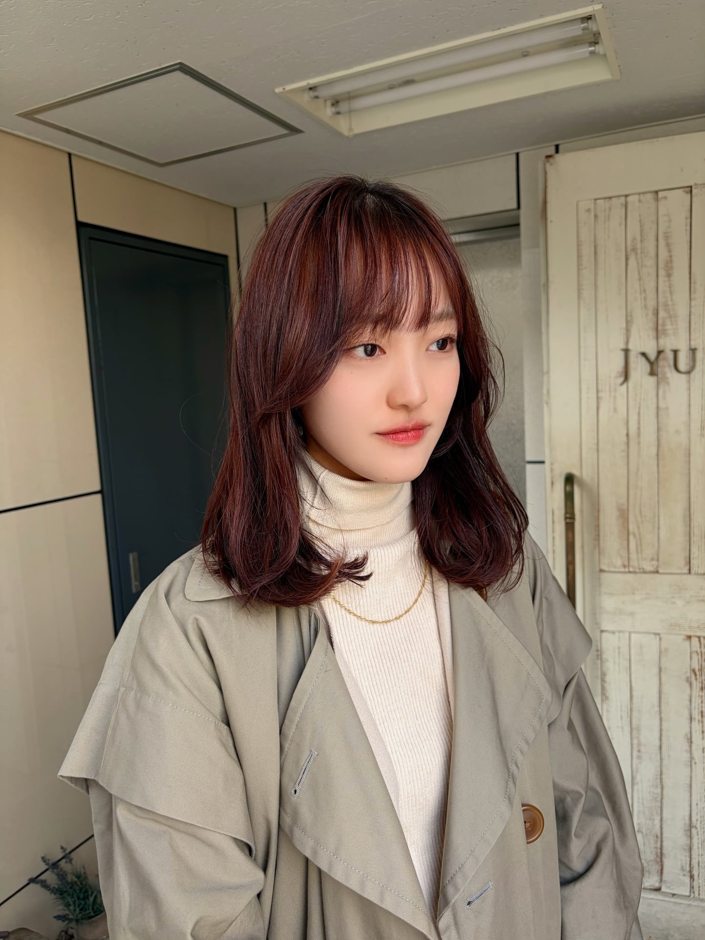 Face-Framing Rose Copper Shoulder-Length Cut with Wispy Fringe