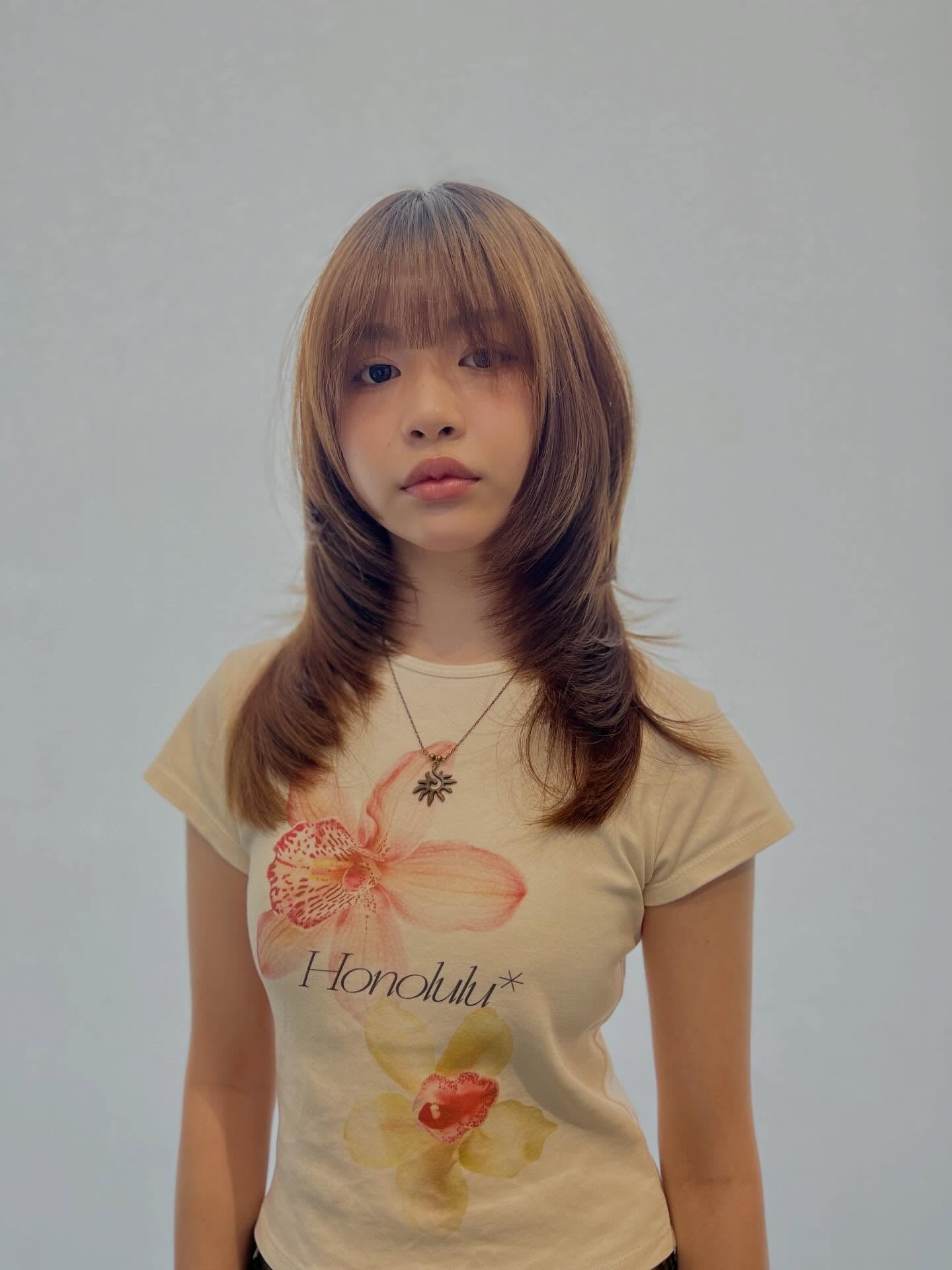 Light Brown Mid-Length Layered Cut with Brow-Skimming Blunt Fringe