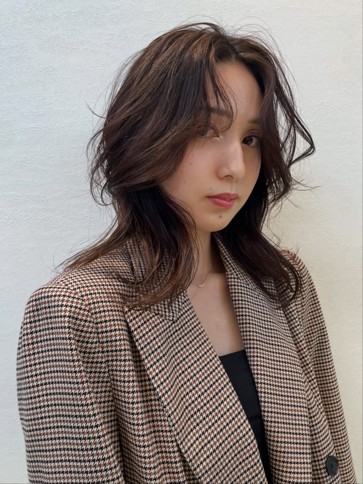 Relaxed Mid-Length Layered Cut with Breezy Curtain Fringe