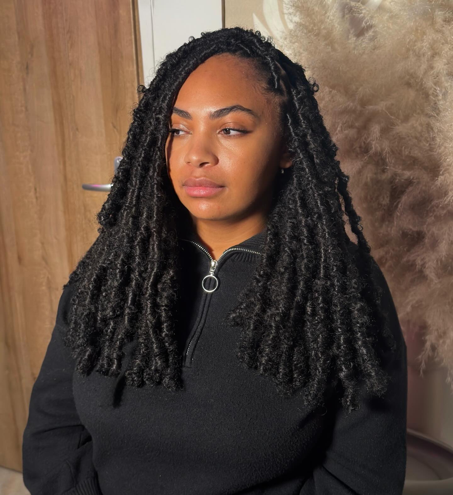 Shoulder-Length Textured Twist Locs with Curly End Detail