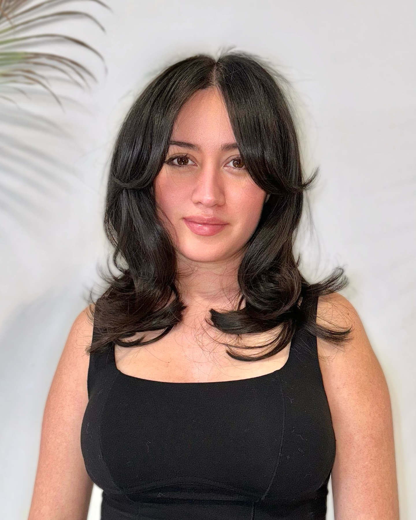 Sleek Medium-Length Layers with Rounded Curtain Bangs