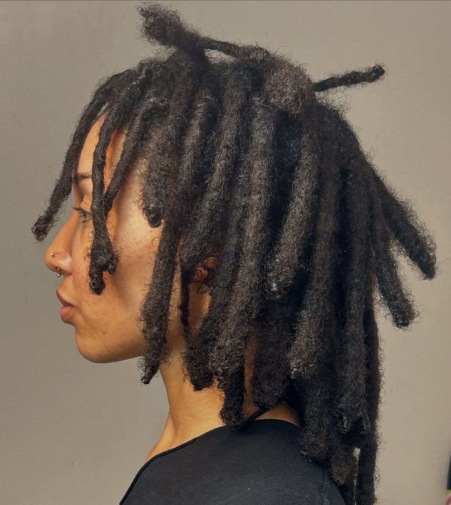Textured Collarbone Locs with Slight Taper and Freeform Tips