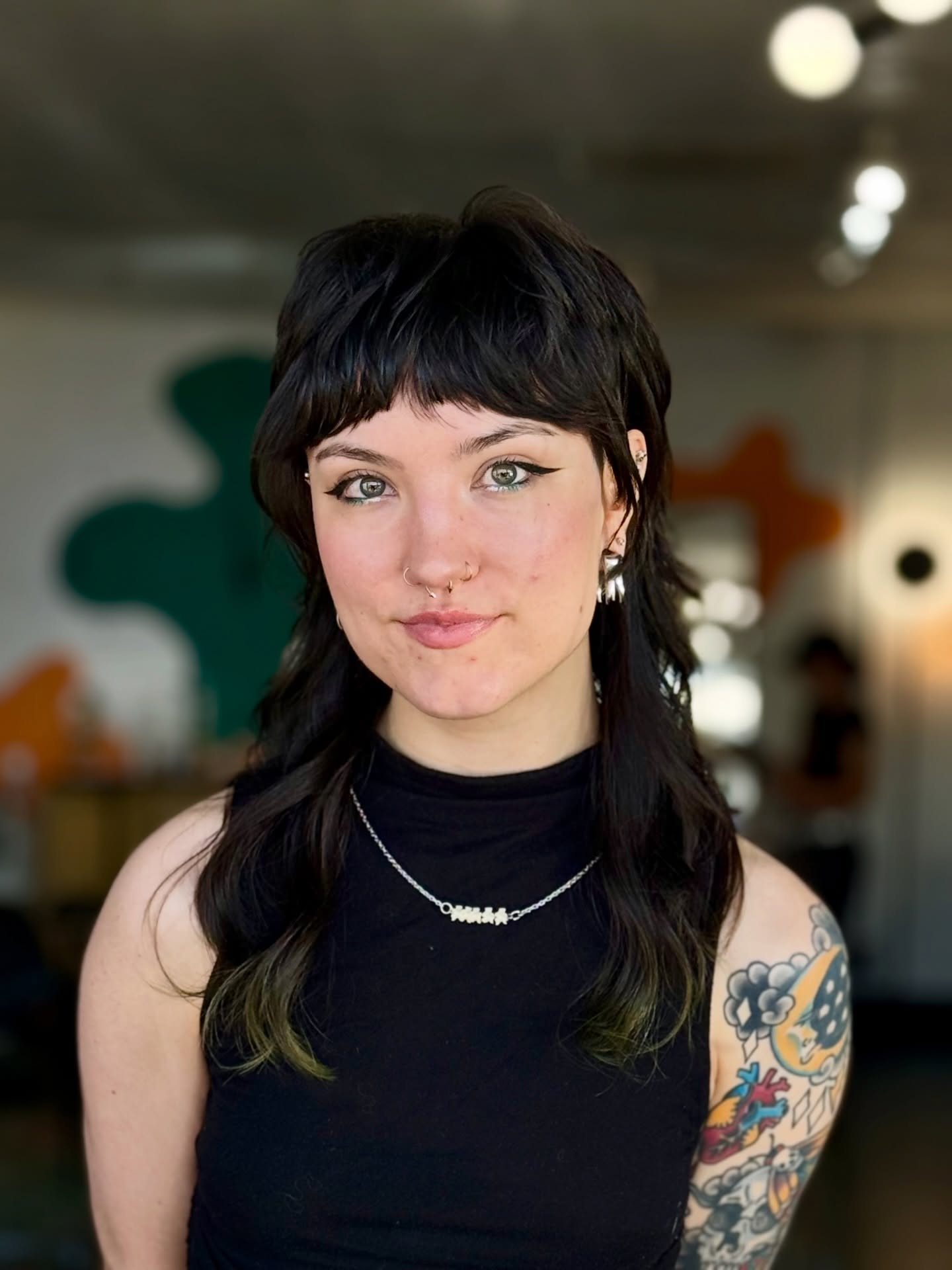 Edgy Short Fringe Layered Mullet with Subtle Green Tips