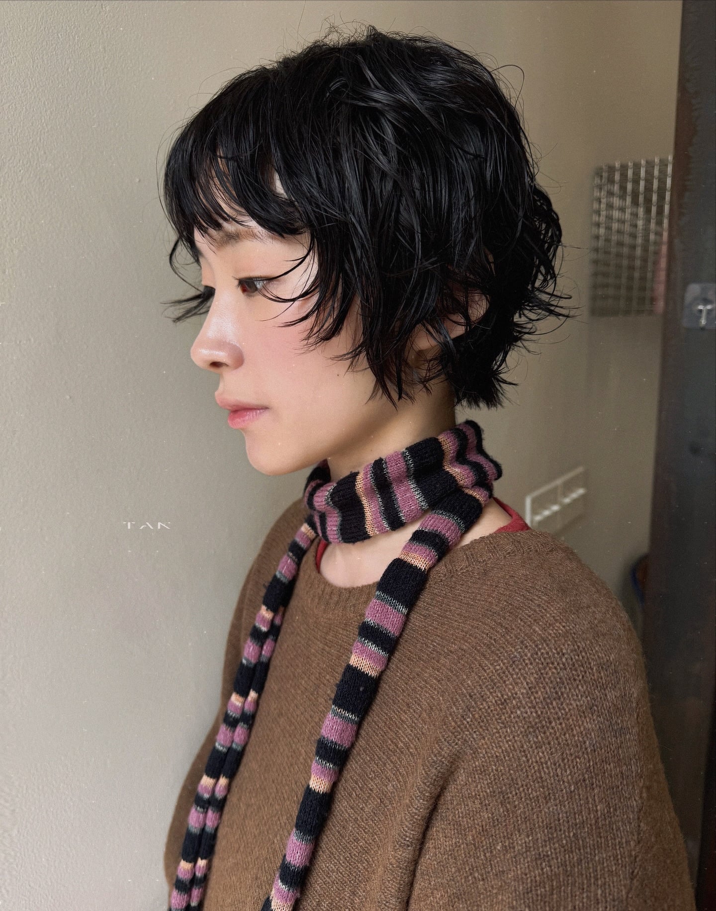 Edgy Tousled Jaw-Grazing Bob with Short Feathered Fringe