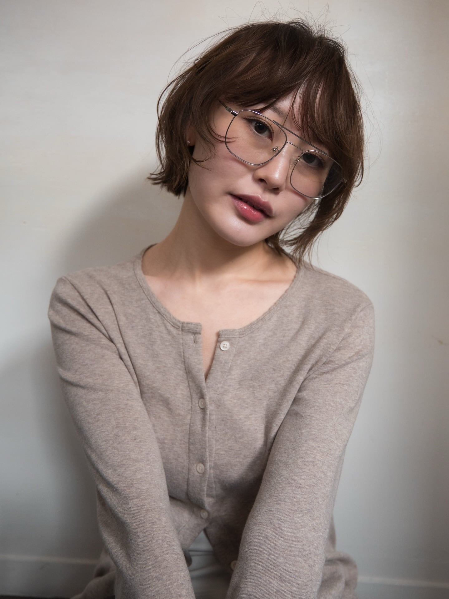 Jaw-Length Choppy Bob with Wispy Bangs and Glasses-Friendly Framing