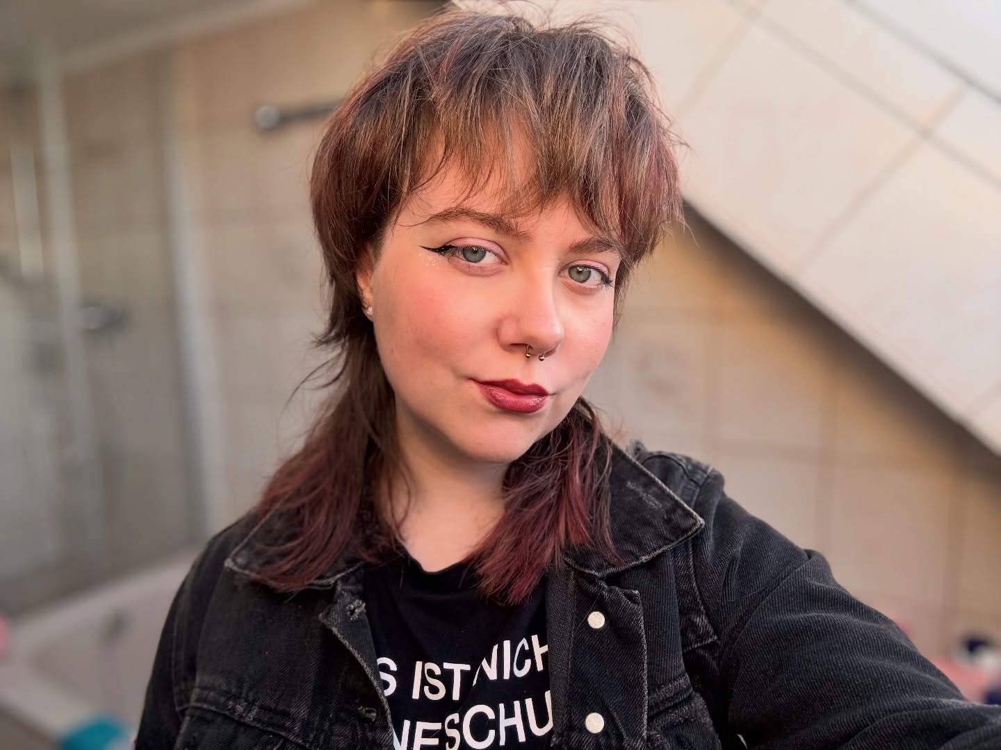 Layered Modern Mullet with Wispy Curtain Bangs and Dusty Rose Tips