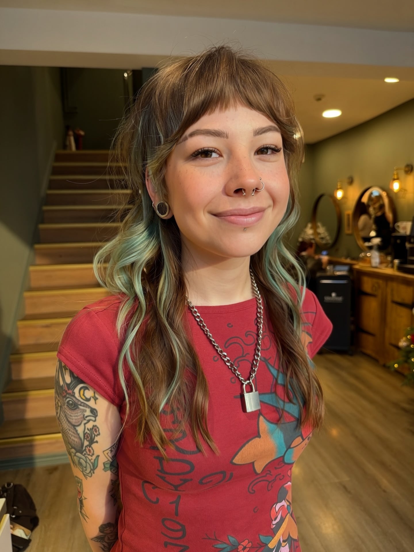 Soft Wavy Layered Mullet with Teal Face‑Framing Highlights
