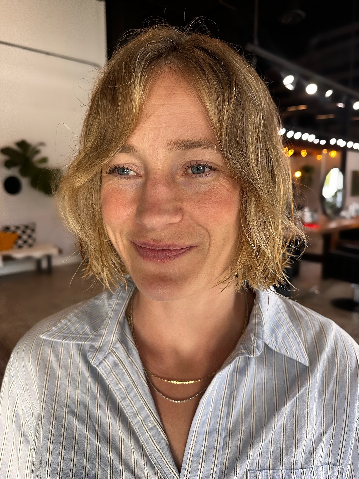 Cheek-Grazing Frayed Bob with Feathered Center Part