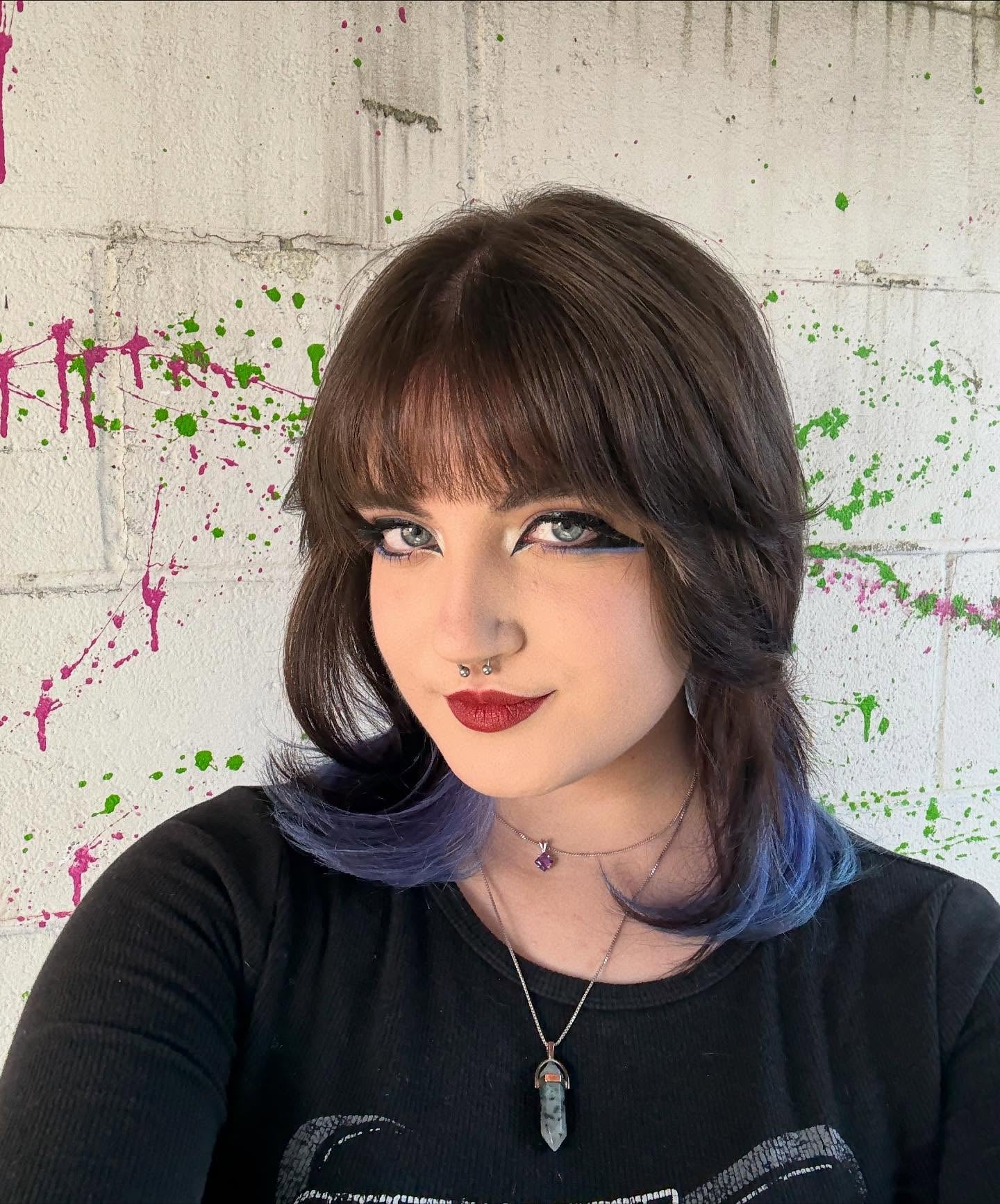 Choppy Short Wolf Cut with Micro-Bangs and Purple Peekaboo