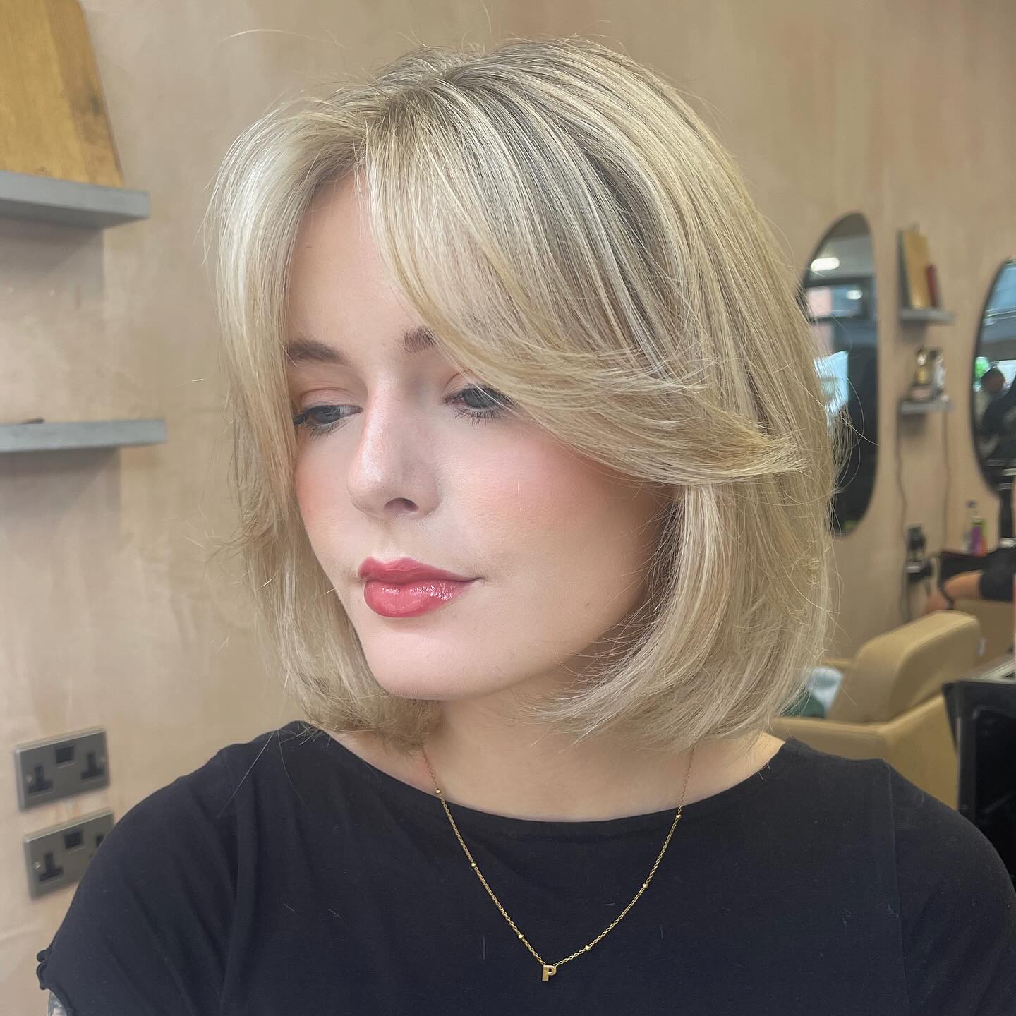 Feathered Blonde Chin-Length Bob with Curtain Face Framing