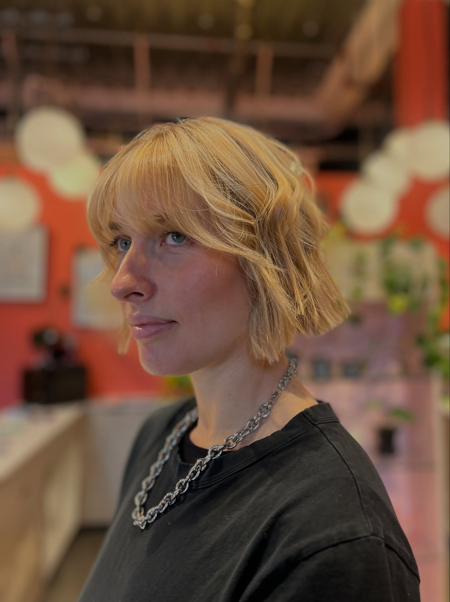 Jaw-Length Beveled Blonde Bob with Curtain Fringe