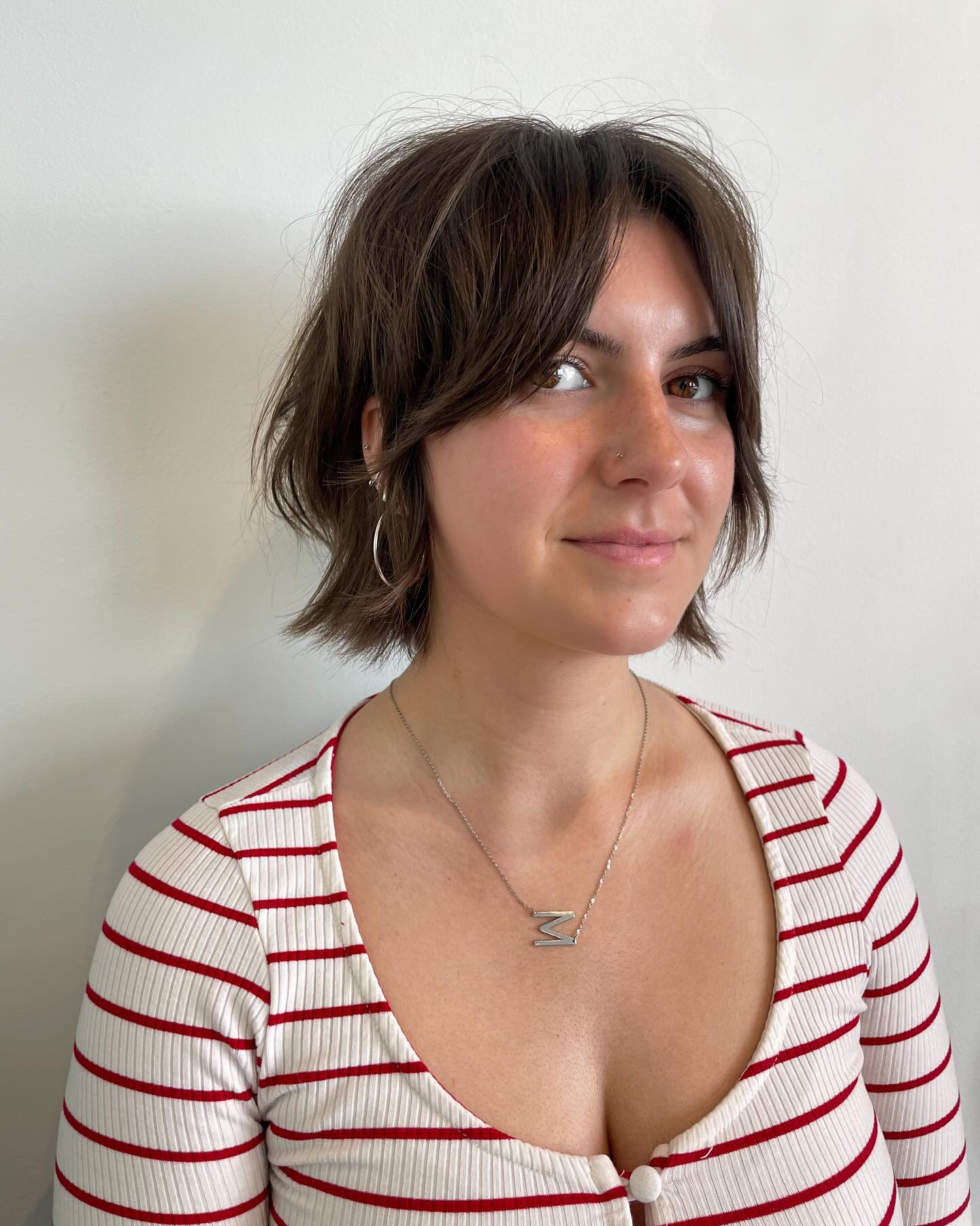 Short Jaw-Length Curtain-Framed Frayed Bob with Subtle Nape Flicks