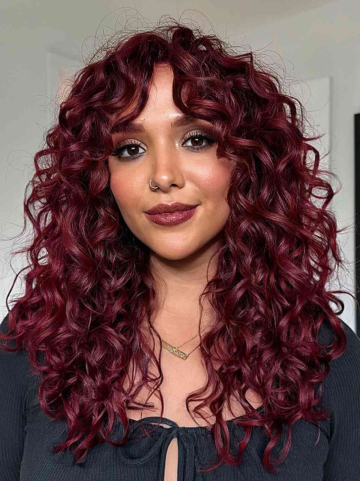 Vibrant Curly Hair with Face-Framing Bangs