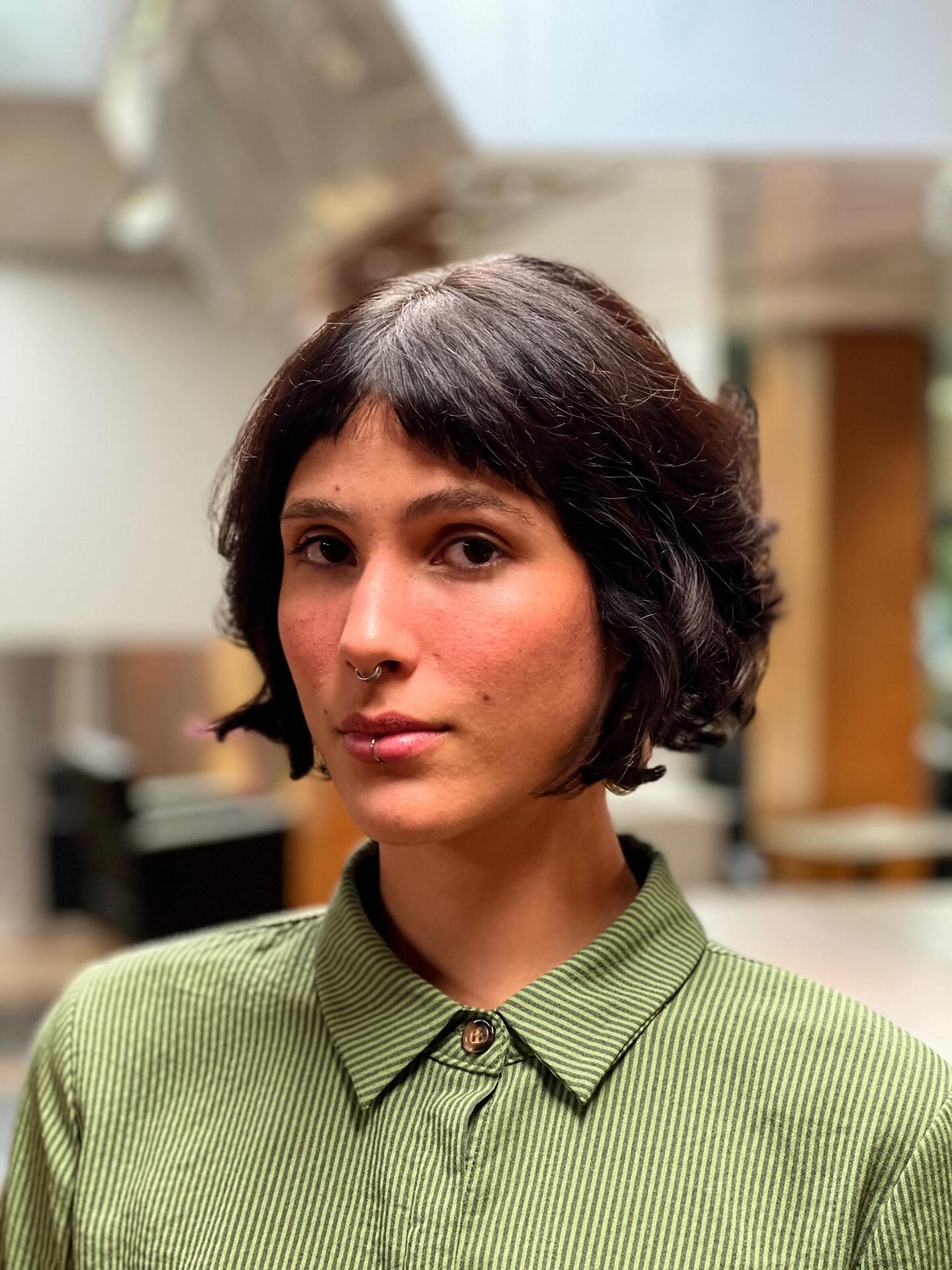 Dark wavy chin-length bob with short wispy bangs