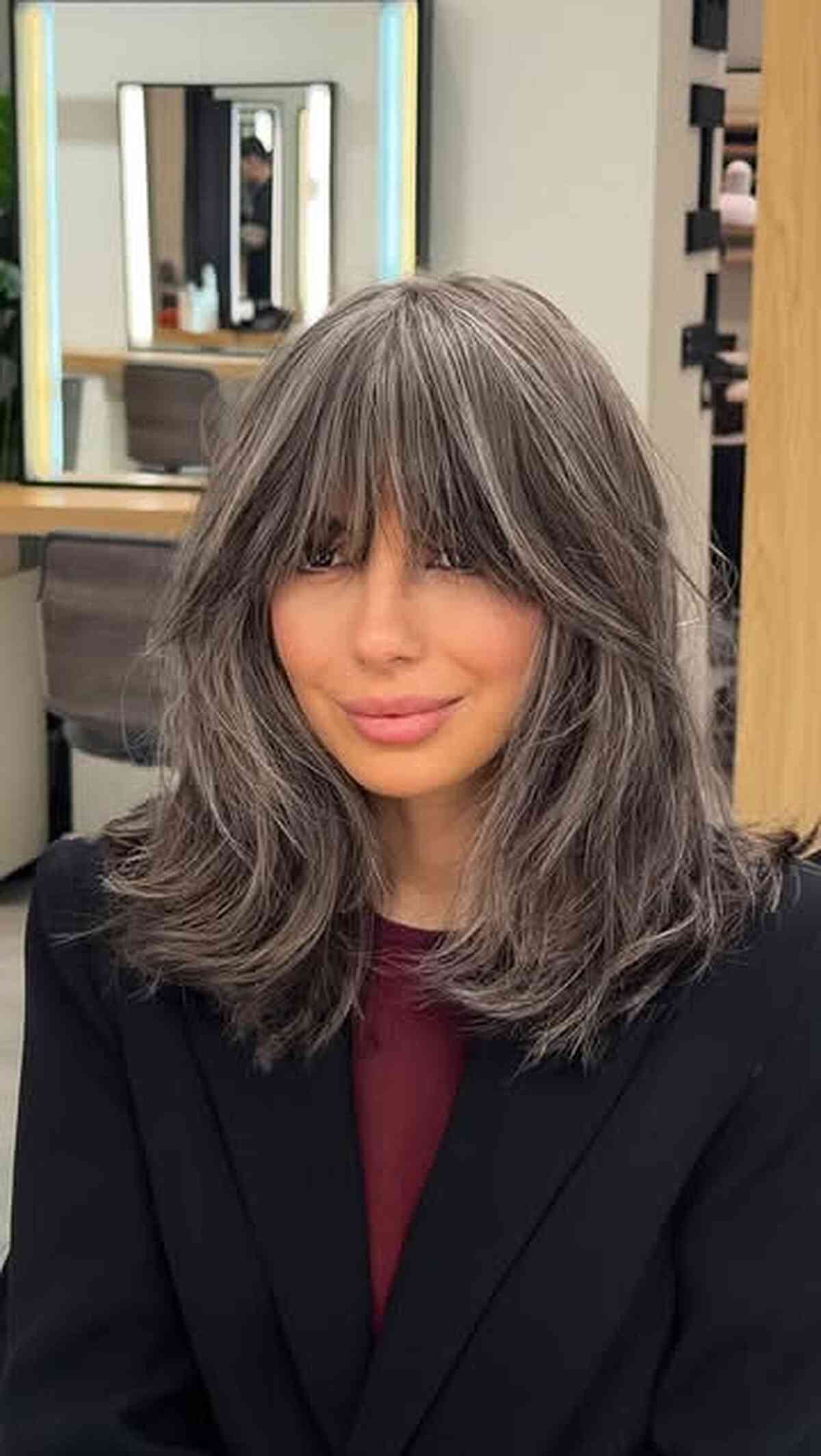 Stylish Medium Layered Gray Haircut with Bangs