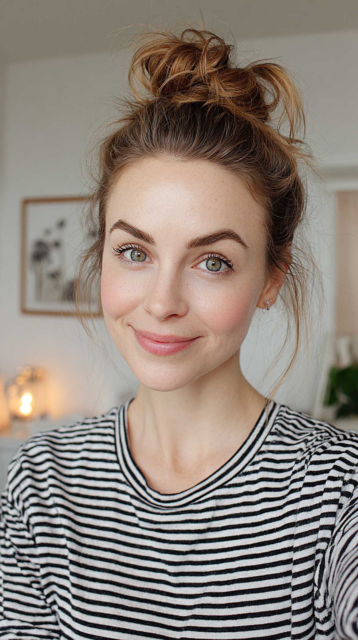 Casual high bun with face-framing wisps