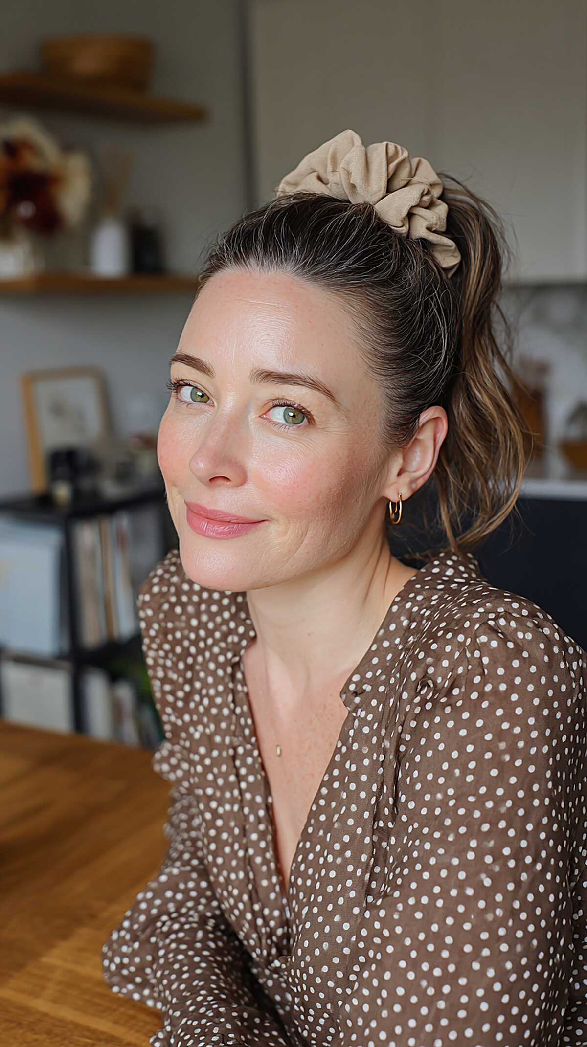 Low ponytail with beige satin scrunchie