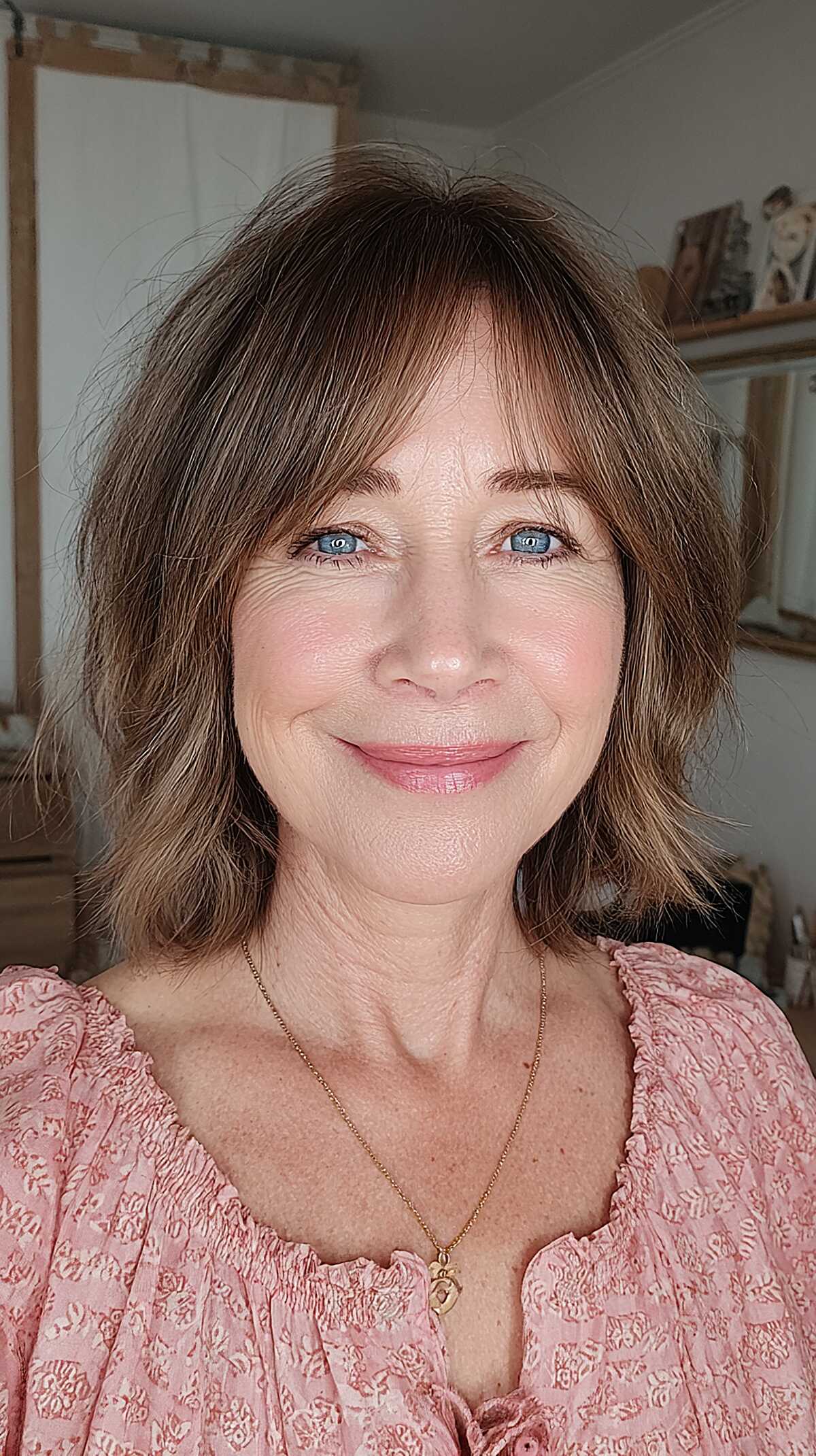 Medium brown layered bob with soft wispy curtain bangs
