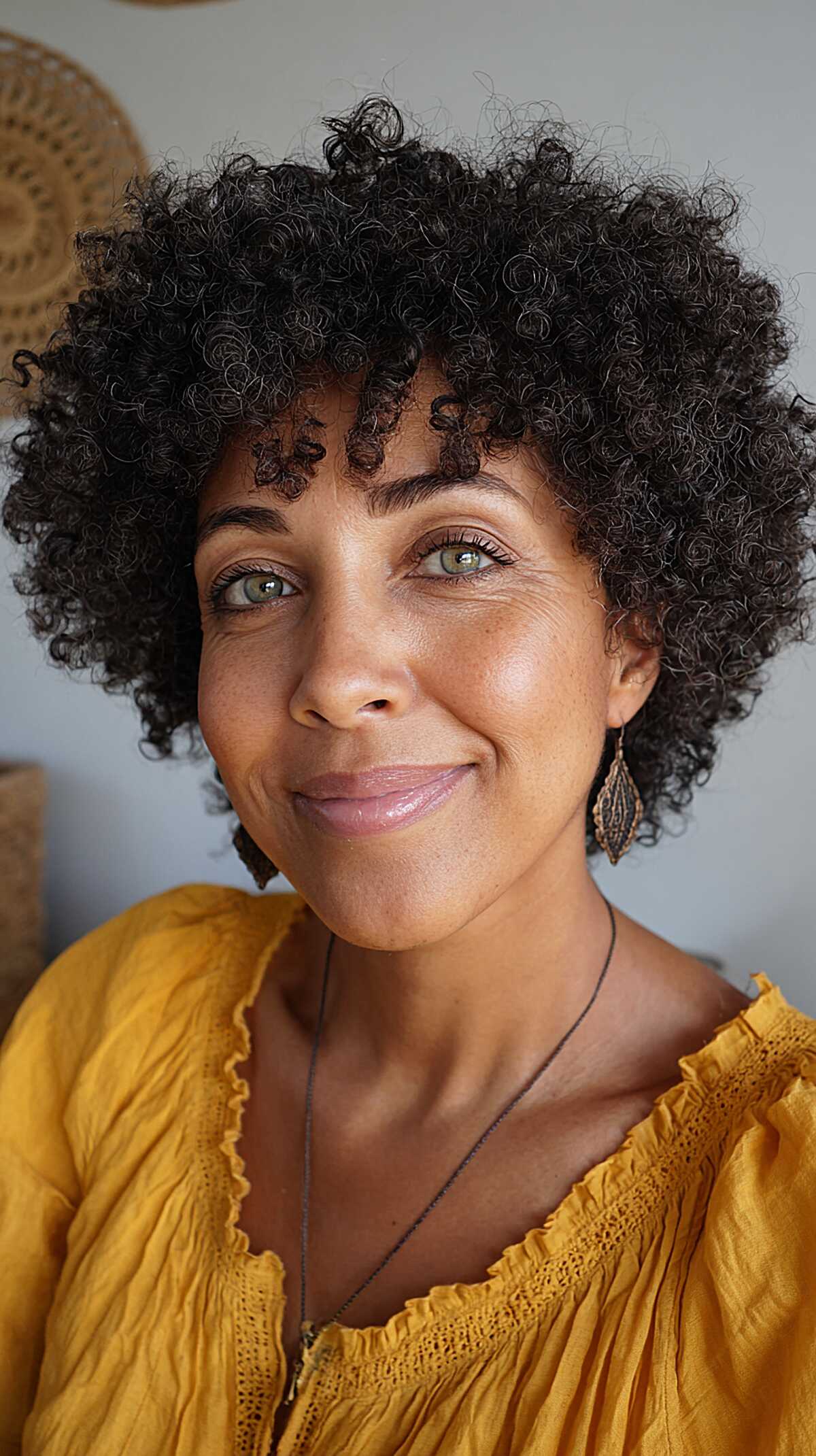 Short natural coily afro with rounded shape and volume