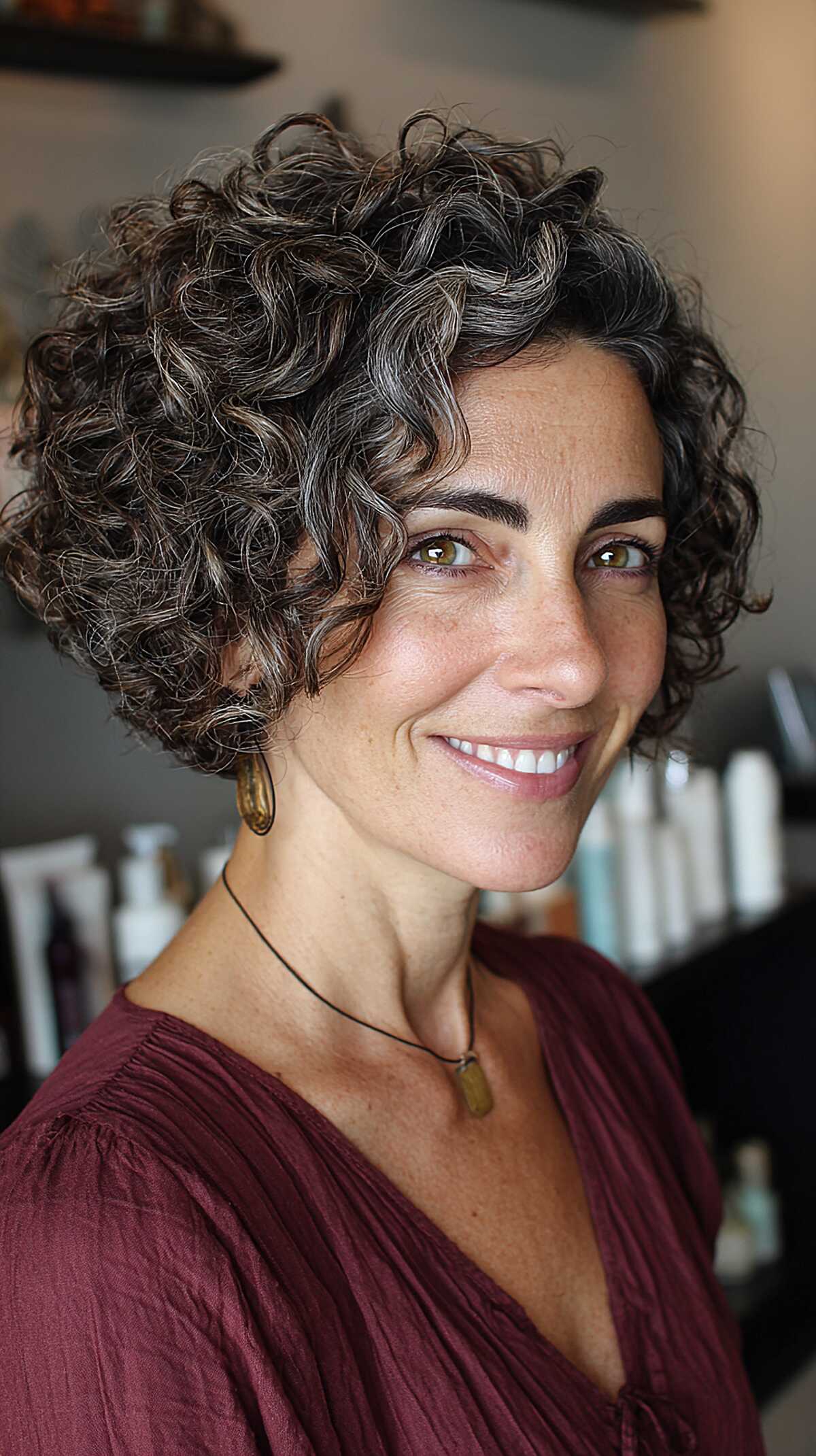 Dark curly bob with natural gray spirals and volume