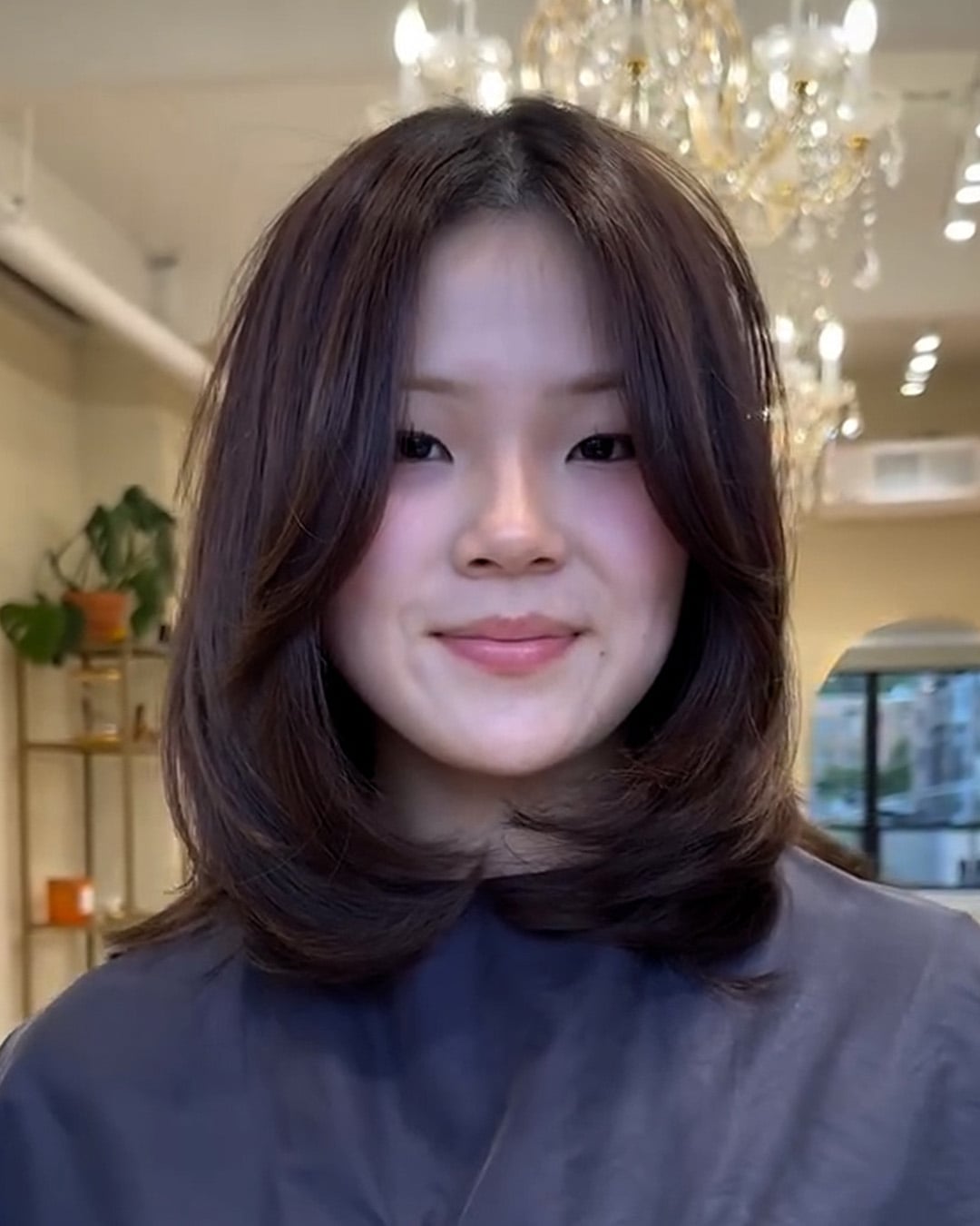 Voluminous dark brown layered lob with curtain part