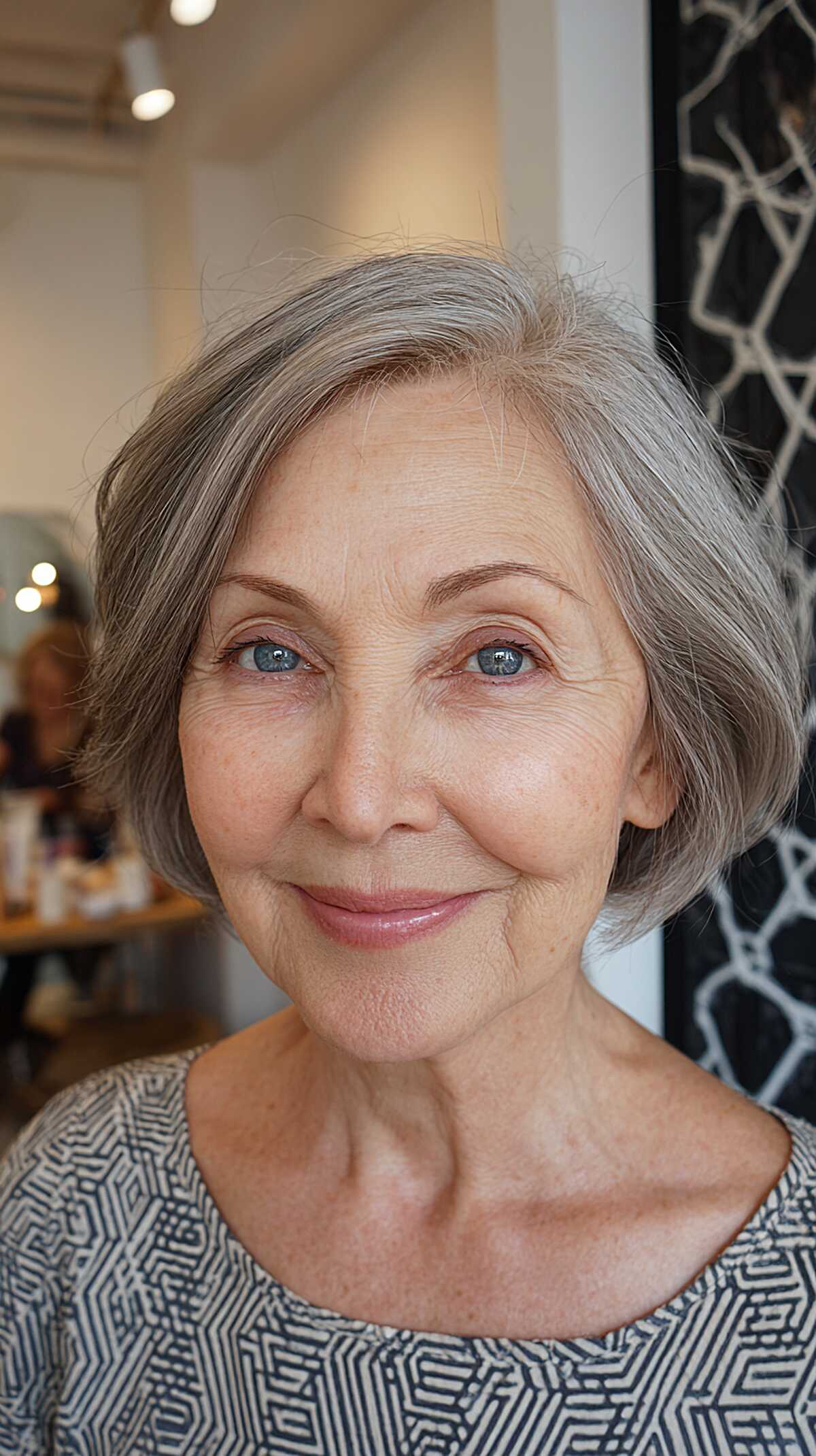 Chin-length grey bob with natural wave and side part