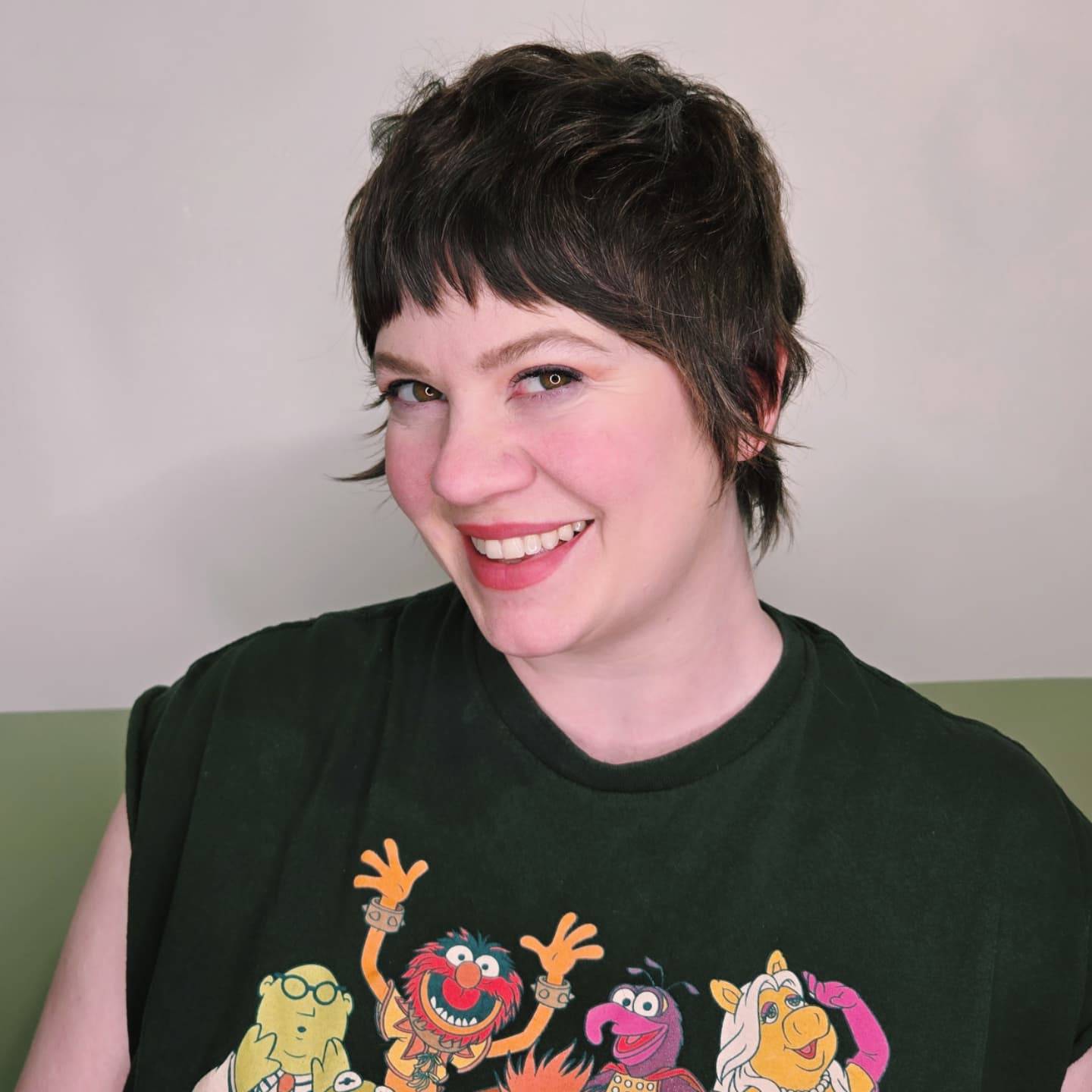 Short choppy brunette pixie cut with piecey bangs