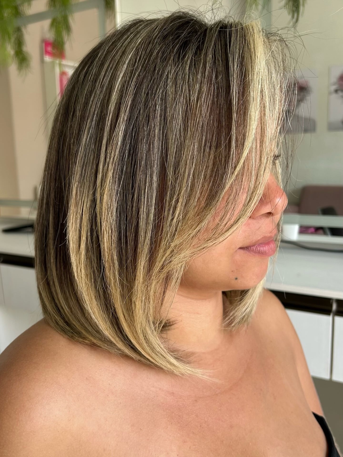 Dark brunette lob with chunky blonde face-framing pieces