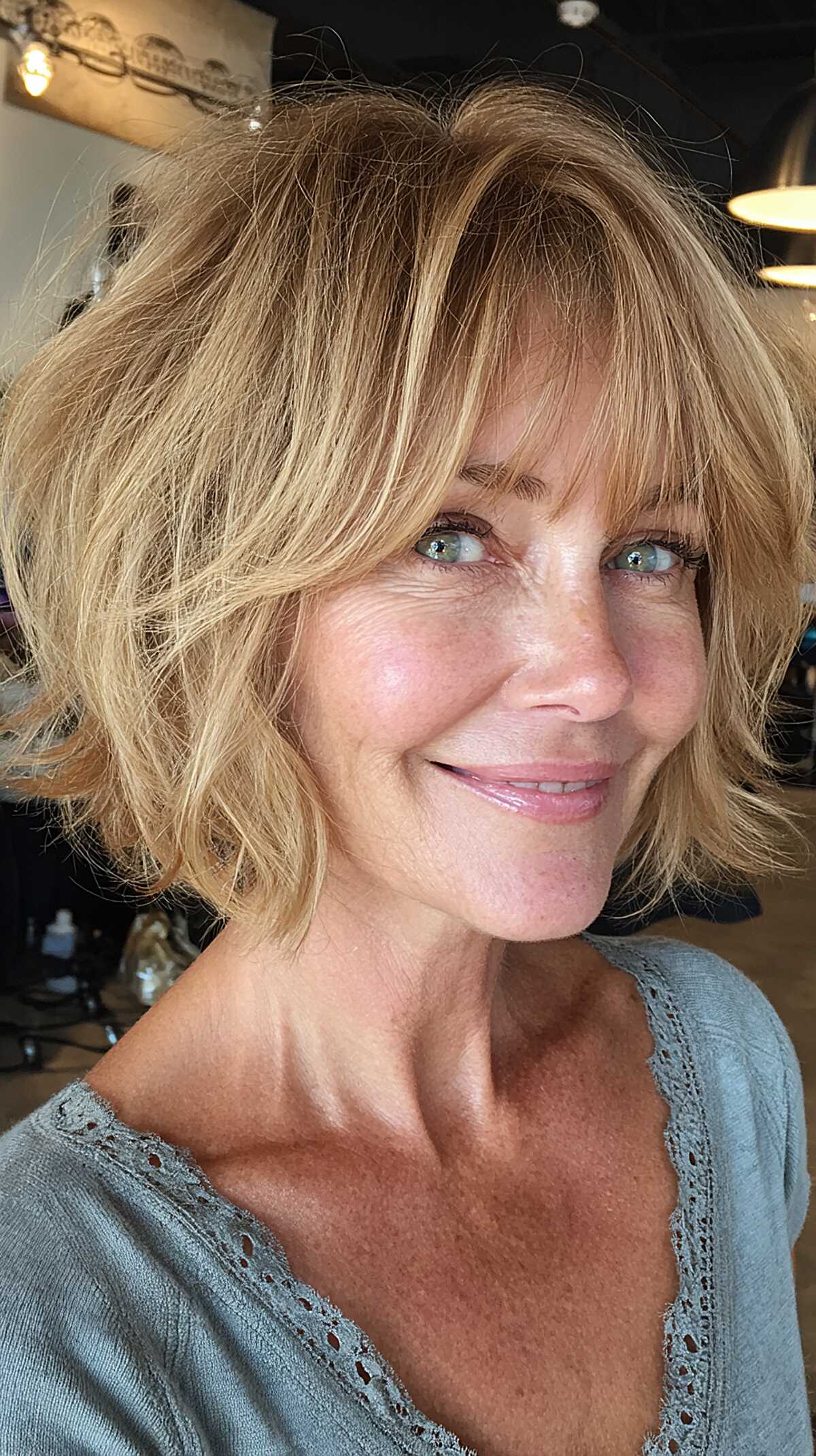 Honey blonde tousled shaggy bob with bangs