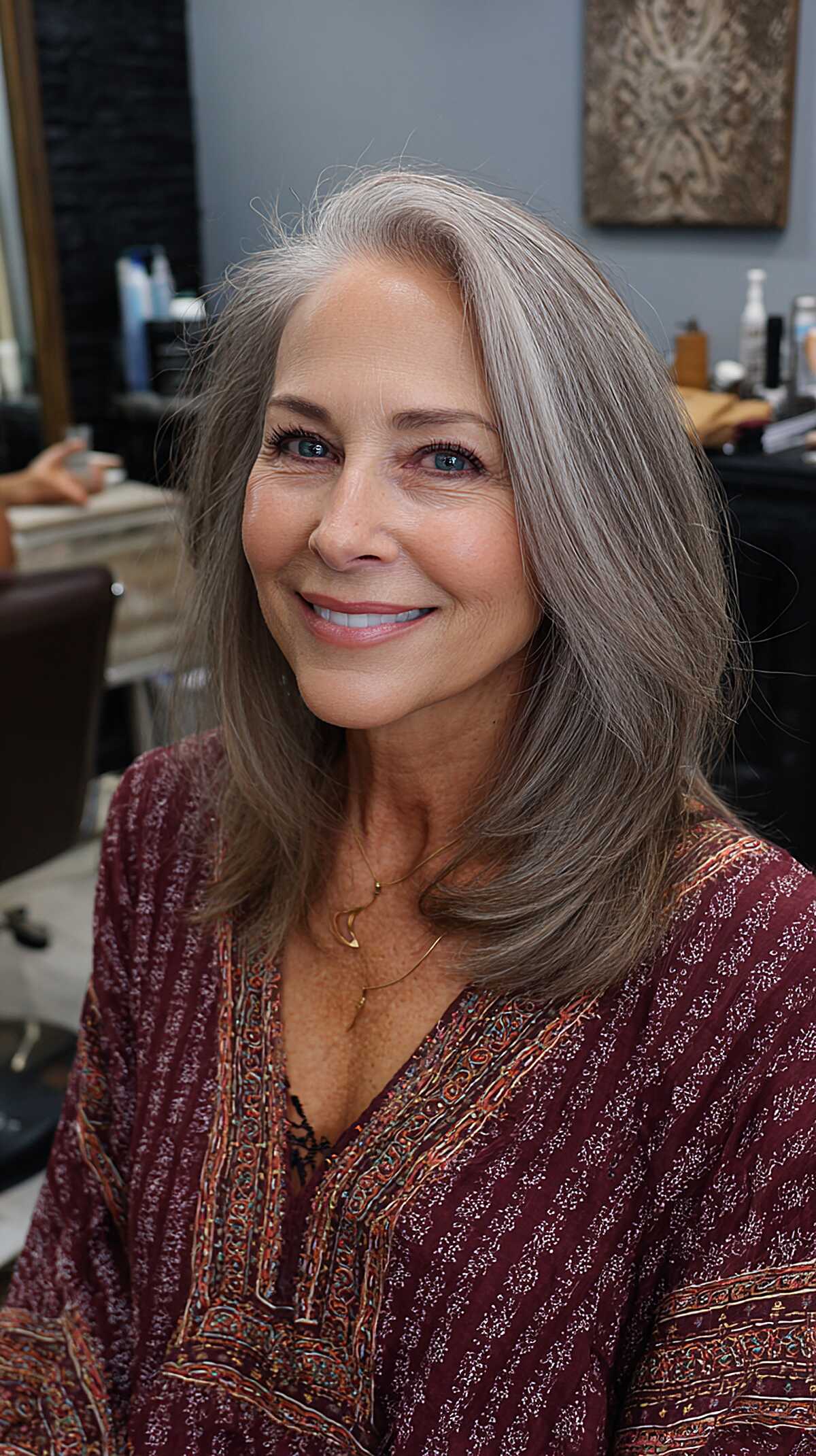 Gray shoulder length hair with swoopy layered ends