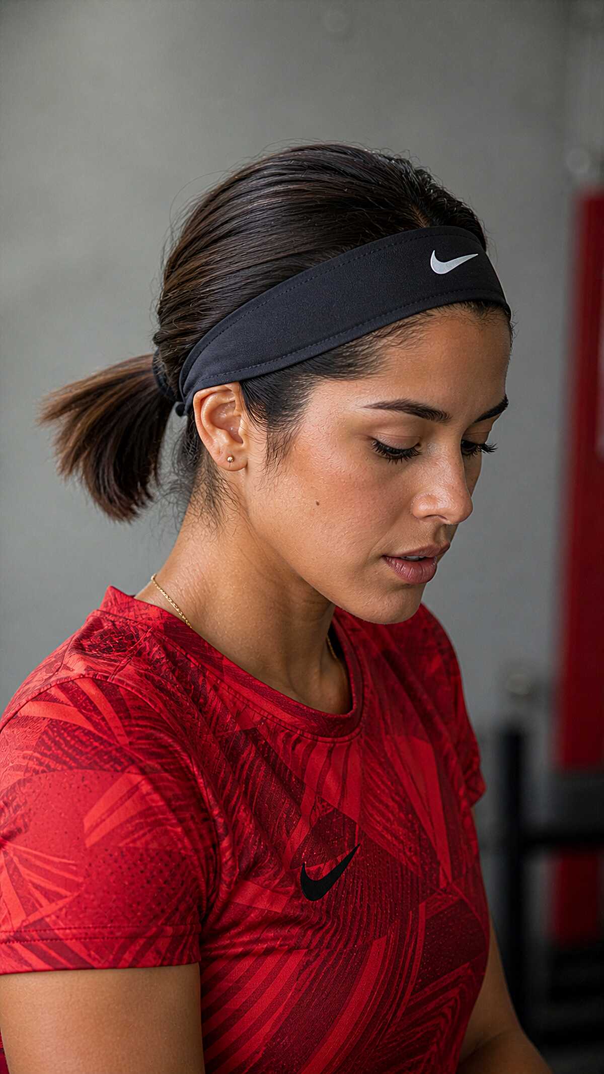 Short low ponytail with a black sport headband