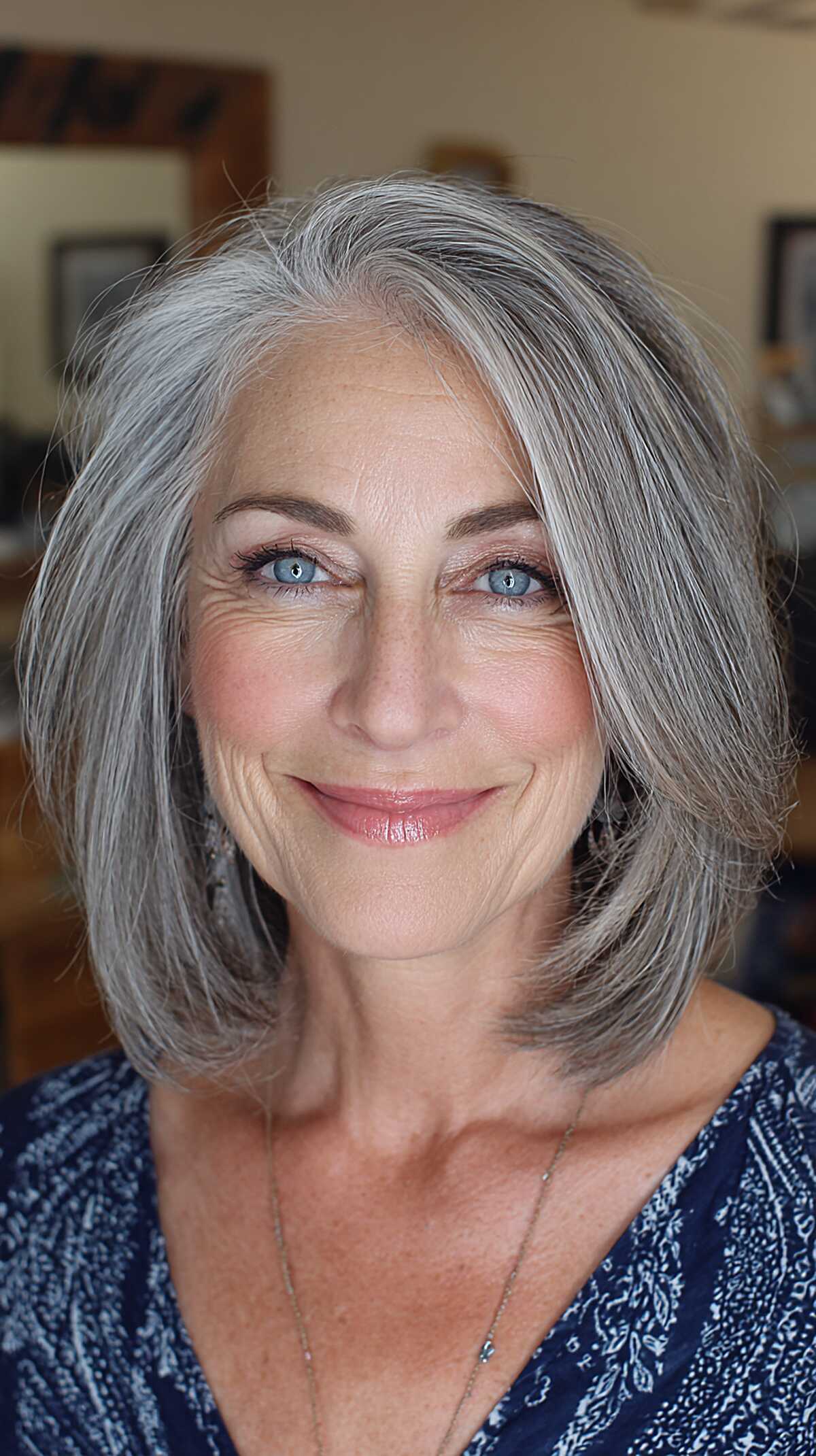 Pewter gray bob with face framing swooped layers
