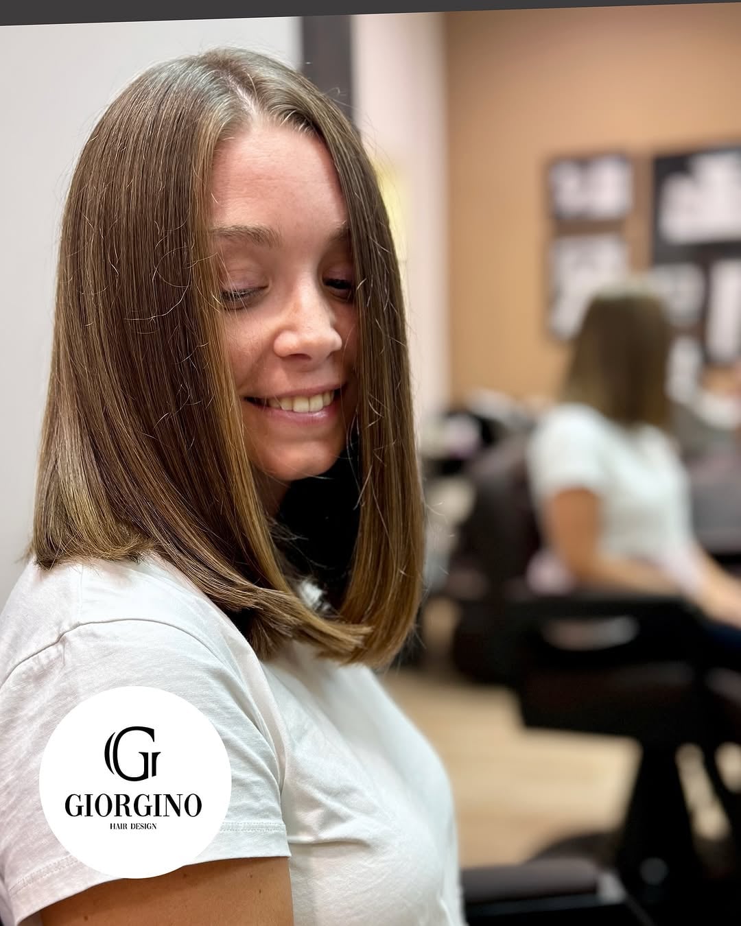 Straight bronde lob with subtle highlights, side view