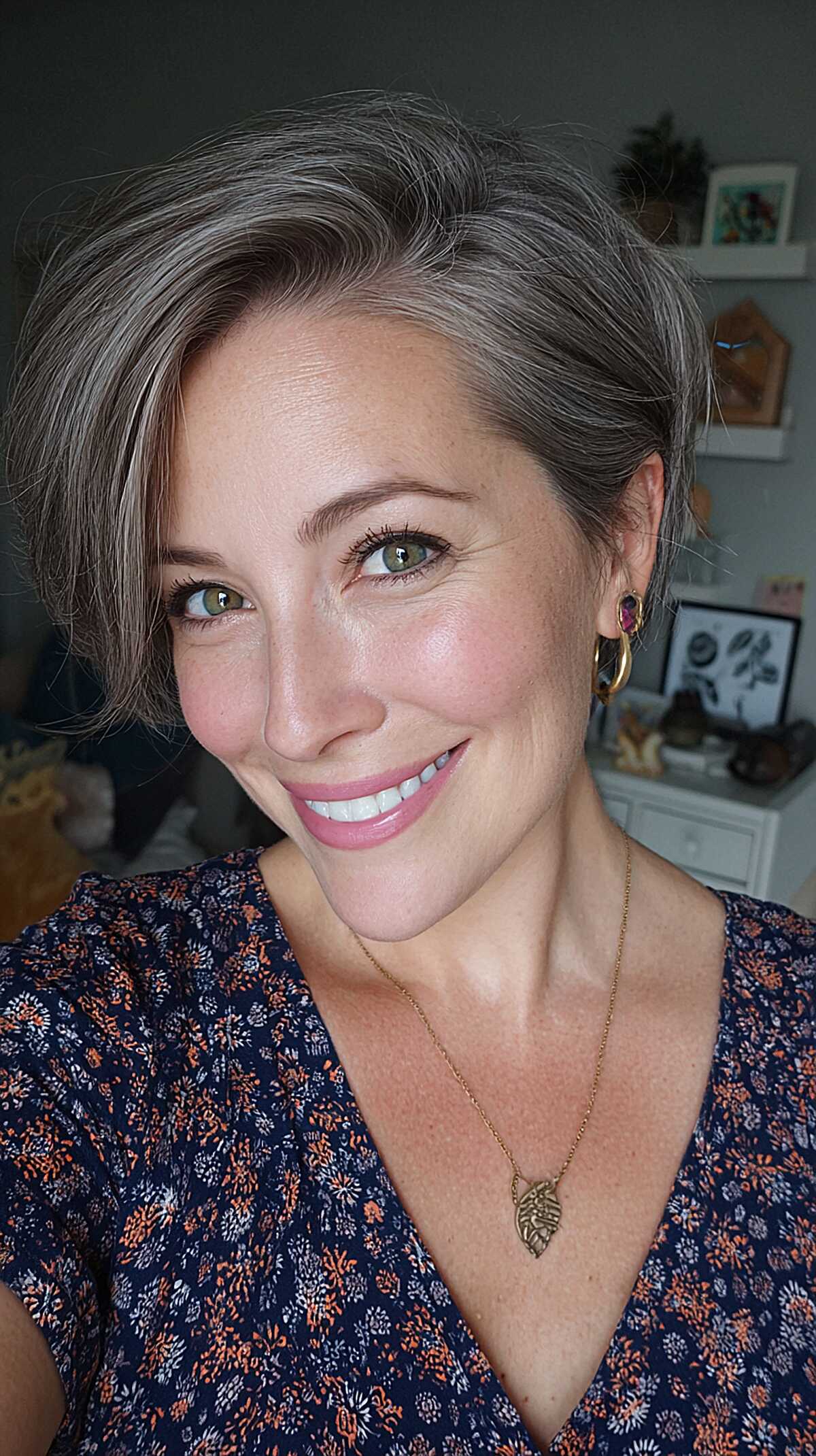 Short silver gray bob with deep side part and volume on top
