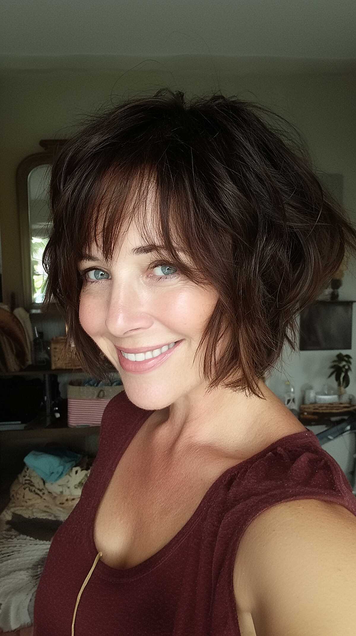 Tousled dark chocolate shaggy bob with wispy bangs